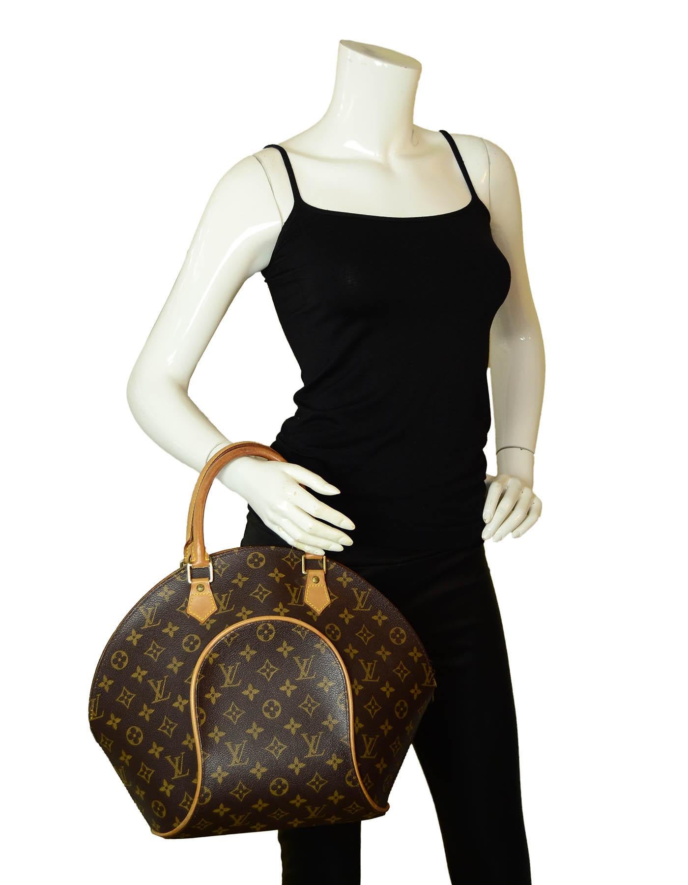 Louis Vuitton Monogram Coated Canvas Ellipse MM Top Handle Bag

Made In: France
Year of Production: 1991
Color: Brown monogram
Hardware: Goldtone
Materials: Coated canvas & vachetta leather
Lining: Brown canvas
Closure/Opening: Zipper
Interior