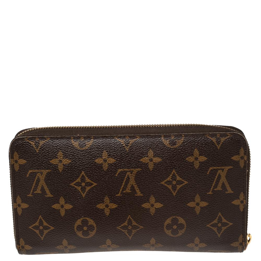 This Louis Vuitton Zippy wallet is conveniently designed for everyday use. Crafted from monogram coated canvas, the wallet has a zip closure that opens to reveal multiple slots, leather-lined compartments, and a zip pocket for you to neatly arrange