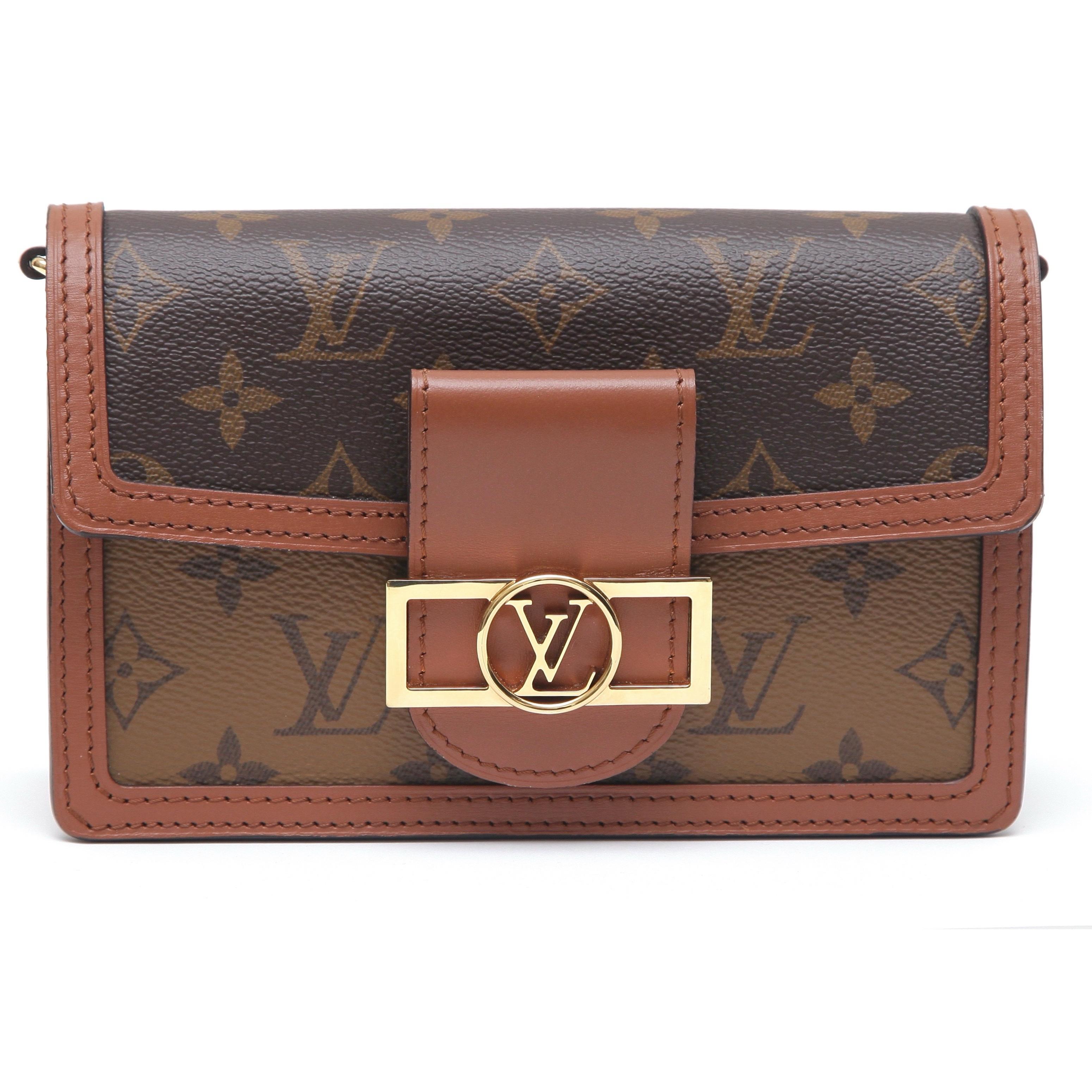 GUARANTEED AUTHENTIC LOUIS VUITTON DAUPHINE CHAIN WALLET

Details:
- Monogram and monogram reverse canvas.
- Leather trim.
- LV circle snap closure.
- Removable gold tone chain.
- Interior lined in black microfiber.
- Card slots.
- Signature found