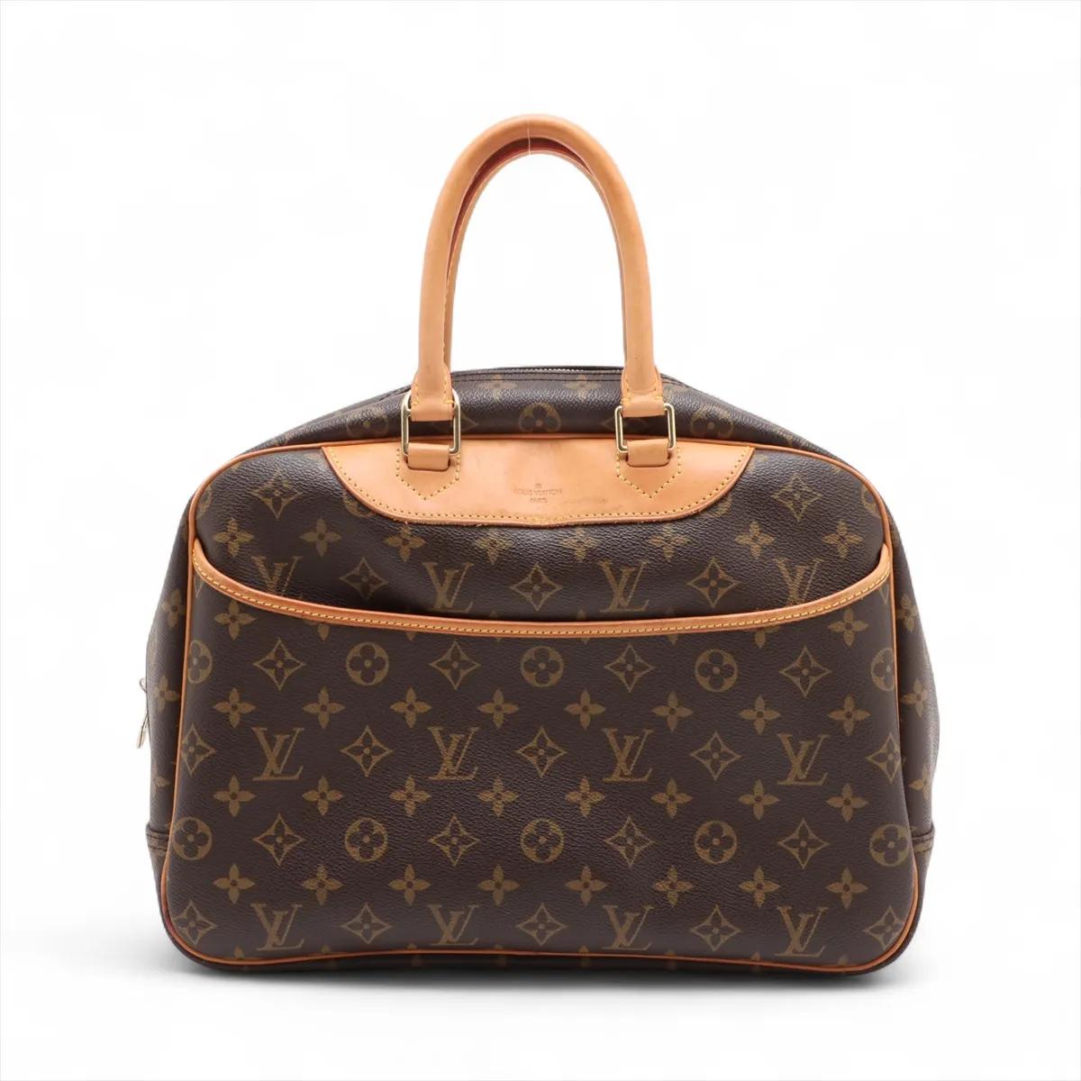 The Louis Vuitton Monogram Deauville is a sophisticated and spacious handbag designed for both elegance and practicality. Crafted from iconic Monogram canvas with natural cowhide leather trim, the structured bag features a wide double-zip closure