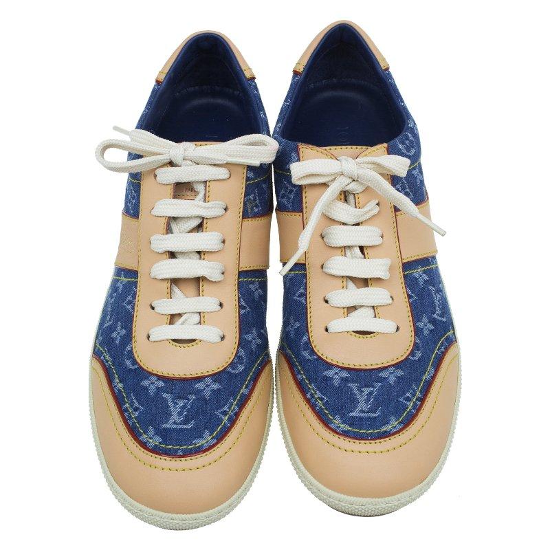 Sporty and chic these Louis Vuitton Denim Monogram & Leather Sneakers will never leave you unnoticed. Their exterior is made from signature monogramed denim and is complemented with beige Vachetta leather. They are equipped with laced up fronts and
