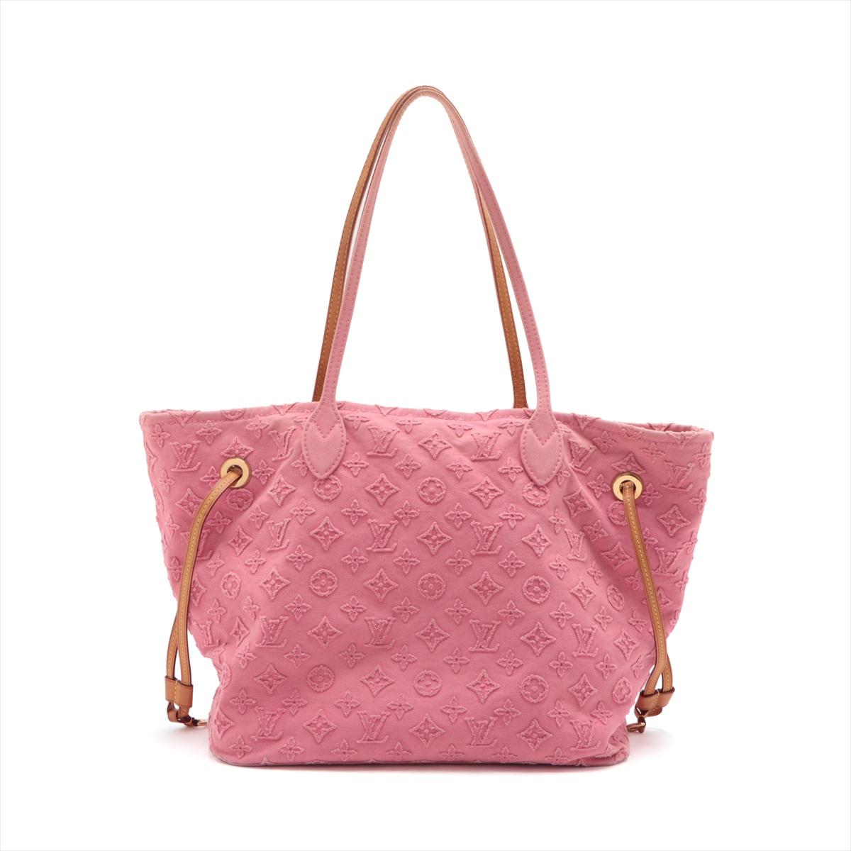 The Louis Vuitton Monogram Denim Applique Neverfull MM in Pink is a distinctive and fashionable variation of the classic Neverfull tote bag. The monogram canvas is complemented by a pink denim material, creating a fresh and contemporary look. It