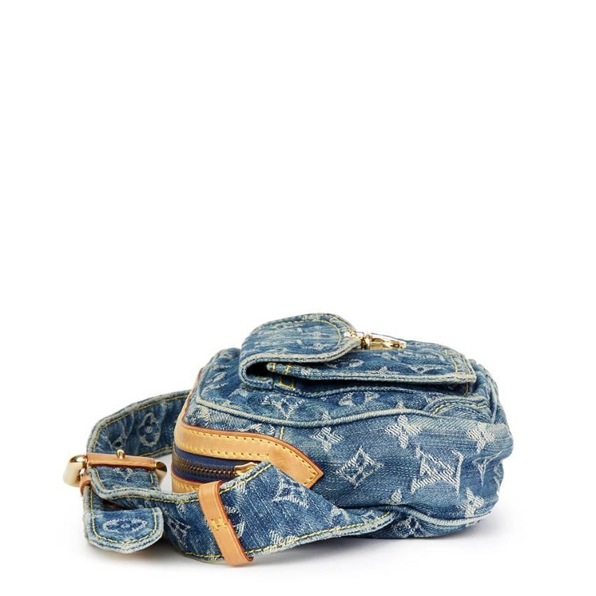 LOUIS VUITTON
Blue Monogram Denim Bum Bag

This LOUIS VUITTON Bum Bag is in Excellent Pre-Owned Condition accompanied by Louis Vuitton Dust Bag. Circa 2007. Primarily made from Denim, Vachetta Leather complimented by Golden Brass hardware.