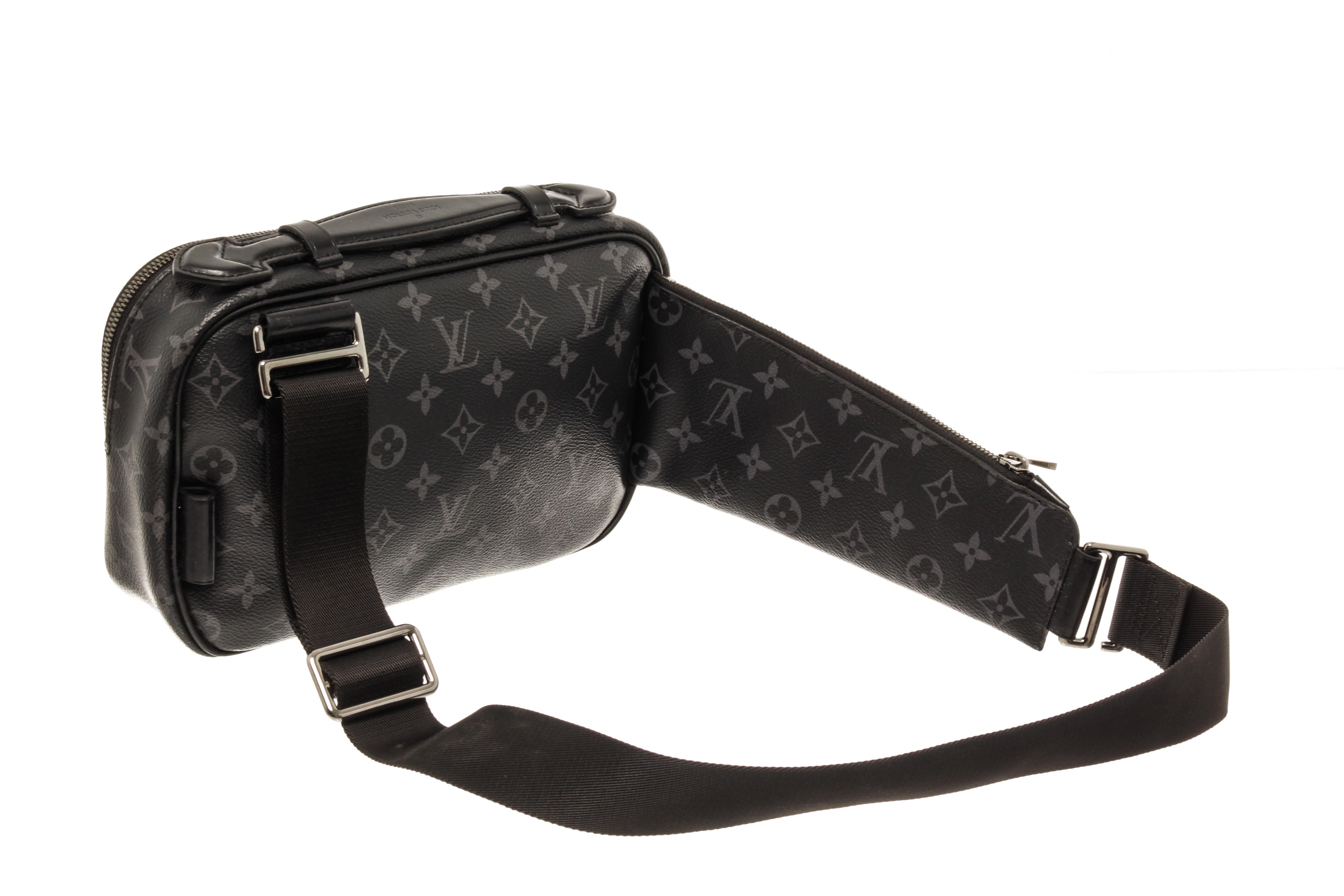 Louis Vuitton Monogram Eclipse Canvas Bumbag with silver tone hardware, black leather trim, black nylon lining, two flat pocket and a zip pocket, and a zipper closure. 

110465MSC