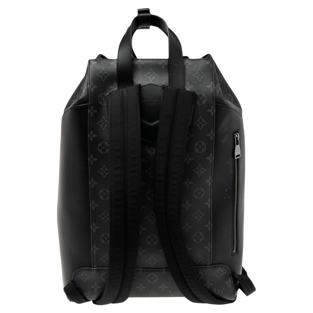 This Explorer backpack from Louis Vuitton is perfect for storing all your things in one place. Made from Monogram Eclipse canvas, this lightweight backpack is your ultimate travel companion. It has a drawstring closure at the top that opens to a