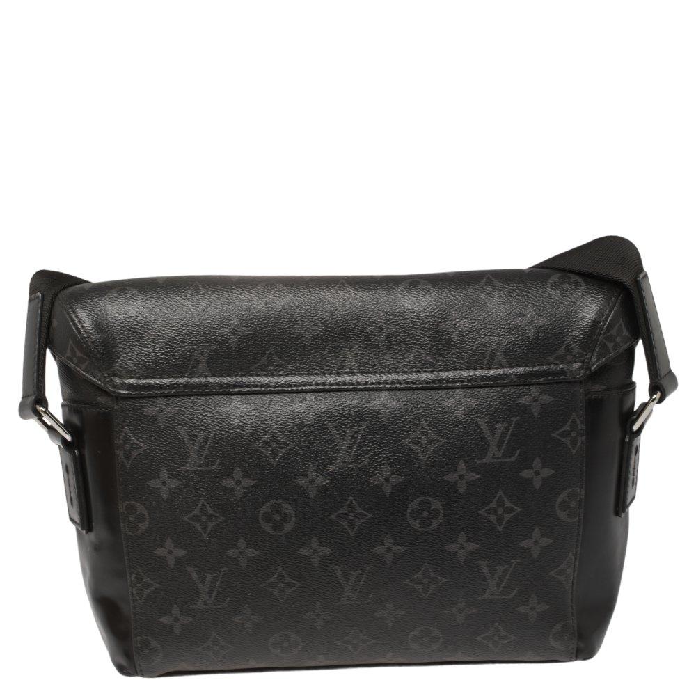 This functional and stylish bag from Louis Vuitton is ideal to carry all your office essentials. It is fashioned in a Monogram Eclipse canvas body with leather trims and two rolled top handles. It comes with an adjustable shoulder strap and secured