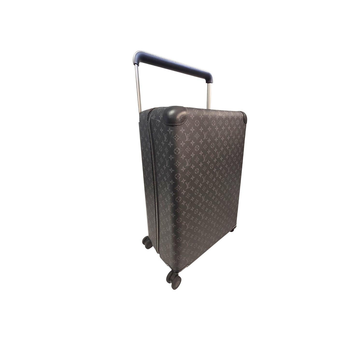 Louis Vuitton Monogram Eclipse (ultra-light) canvas Horizon 70 with aluminum hardware, dual flat handles; one at side, one at top, retractable pull-handle at top, four spinner wheels at base, tonal mesh lining, dual interior zip pockets; dual
