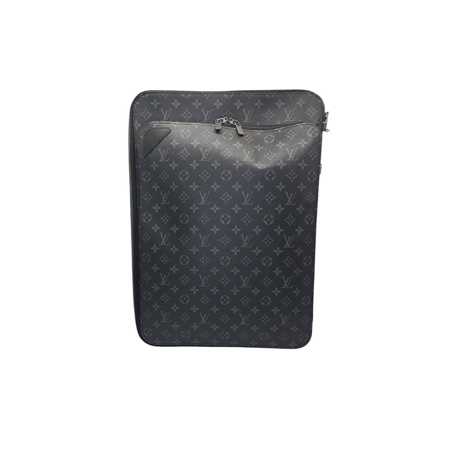 Indulge in luxury travel with the Louis Vuitton Monogram Eclipse Pegase Trolley Case. Crafted in masculine Monogram Eclipse canvas with cowhide leather trimmings. It features a zipped front compartment with padded pockets for a laptop, tablet,