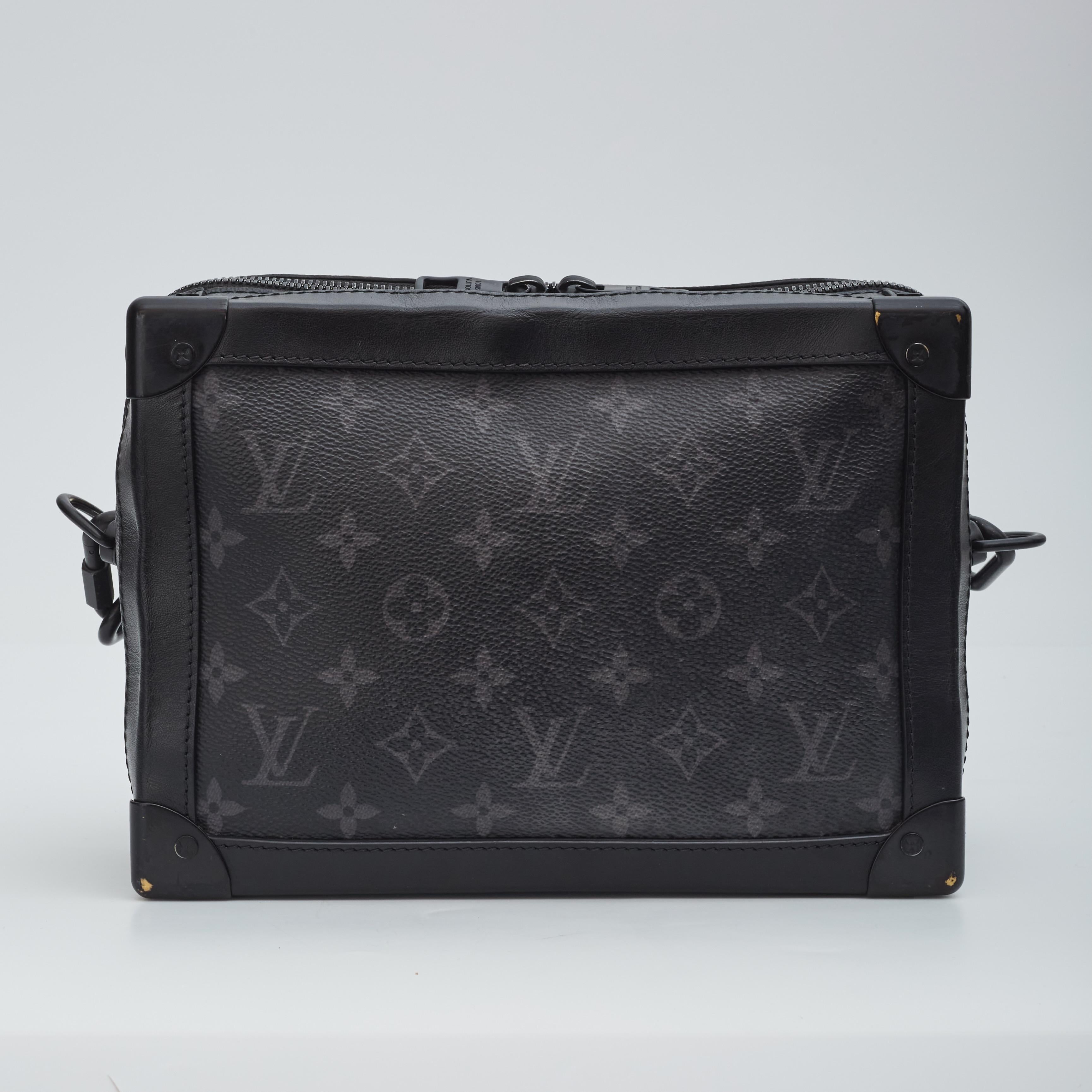 This bag from Virgil Abloh's 2020 collection. is crafted in signature Louis Vuitton monogram canvas in black aka Monogram Eclipse. The bag features an adjustable black shoulder strap, matte black hardware, leather trim, zip closure, and opens to a