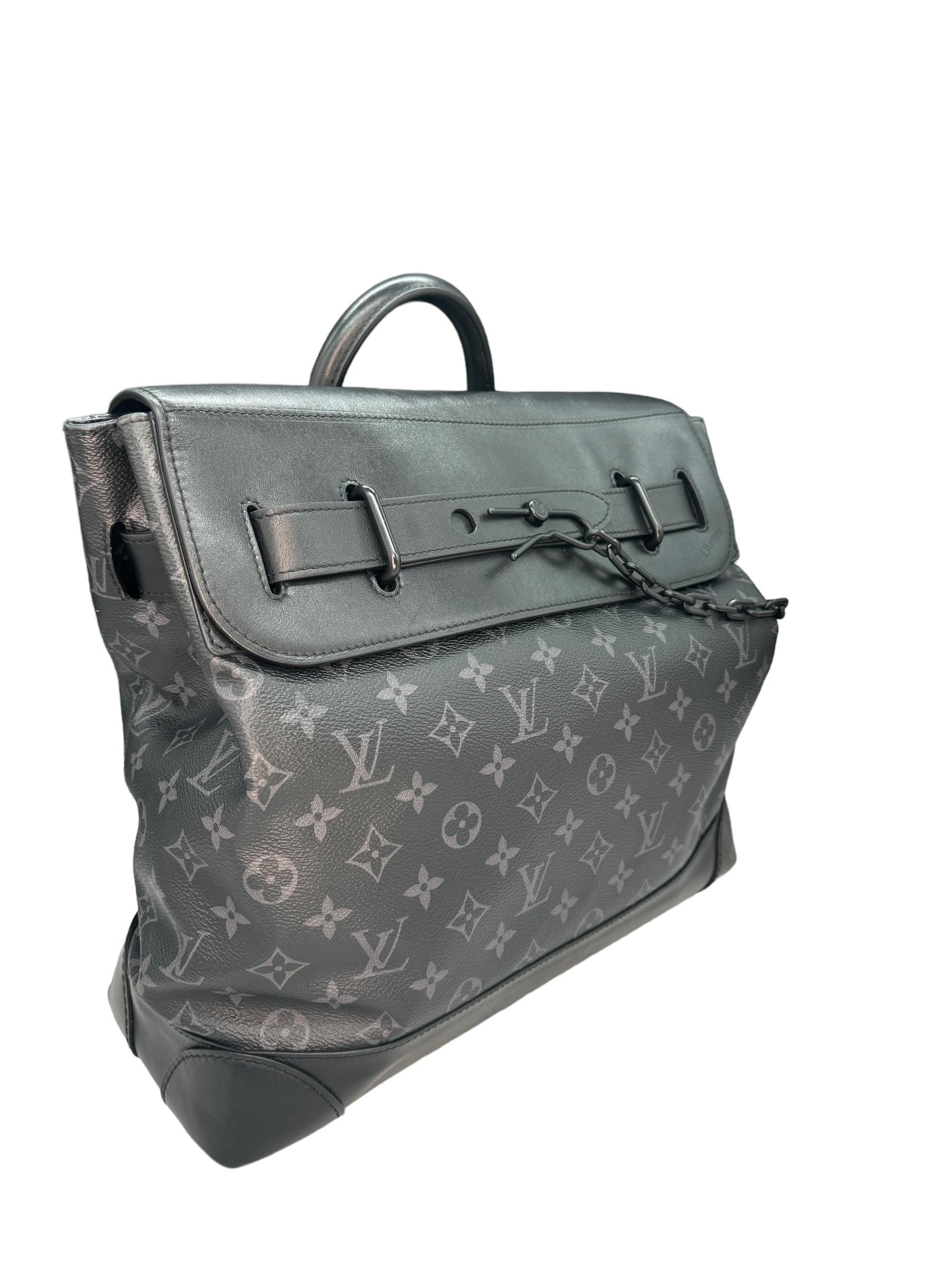 Louis Vuitton Monogram Eclipse PM. This bag was crafted with a combination of black leather and LV's iconic black and grey Monogram Eclipse canvas. It comes with a removeable black leather shoulder strap and matte black hardware. It features a