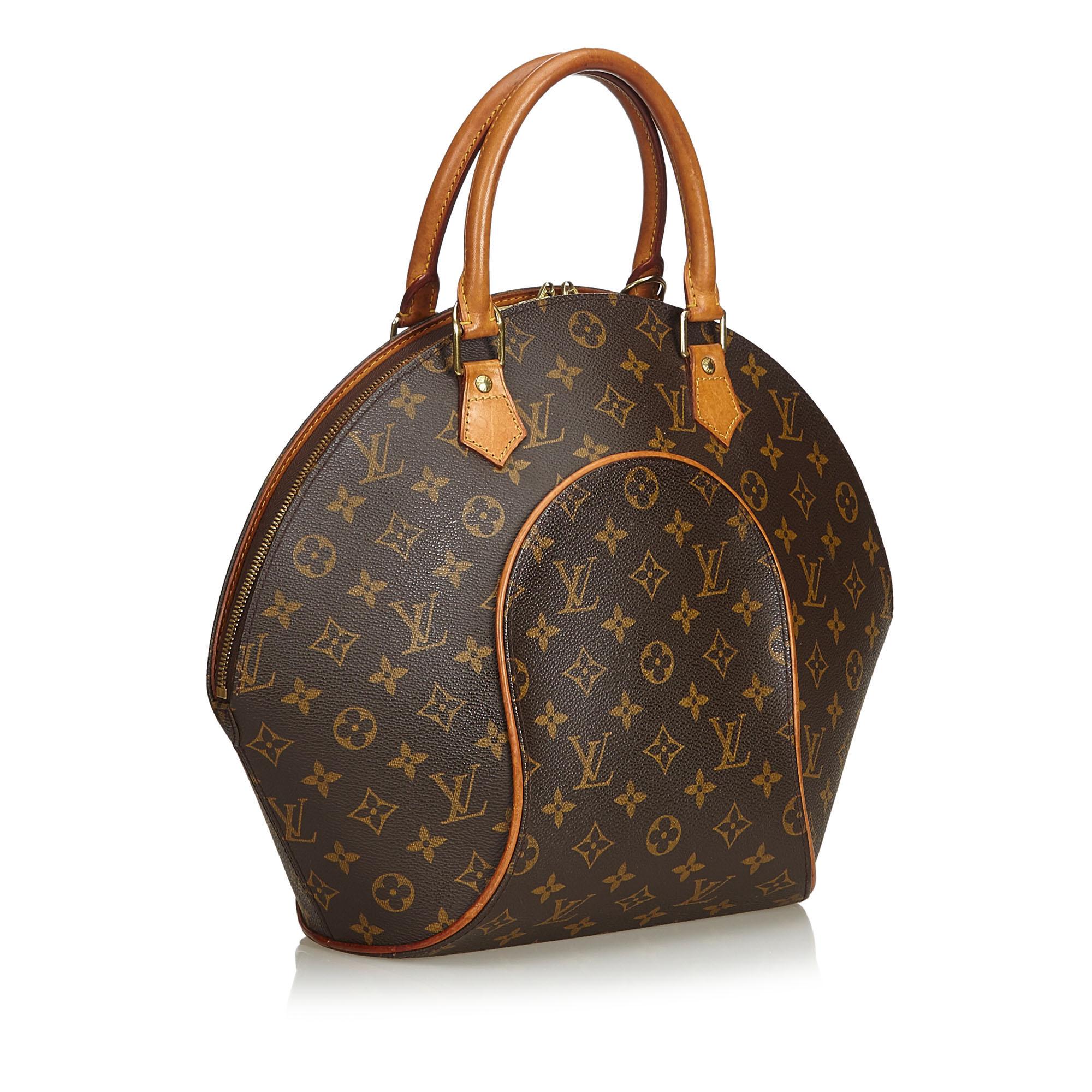 The Louis Vuitton Ellipse MM bowling bag features rolled vachetta handles, the classic LV Monogram canvas, vachetta trim, a top zip closure, an interior flat pocket, and a D-ring hardware.

Serial number: MI0959