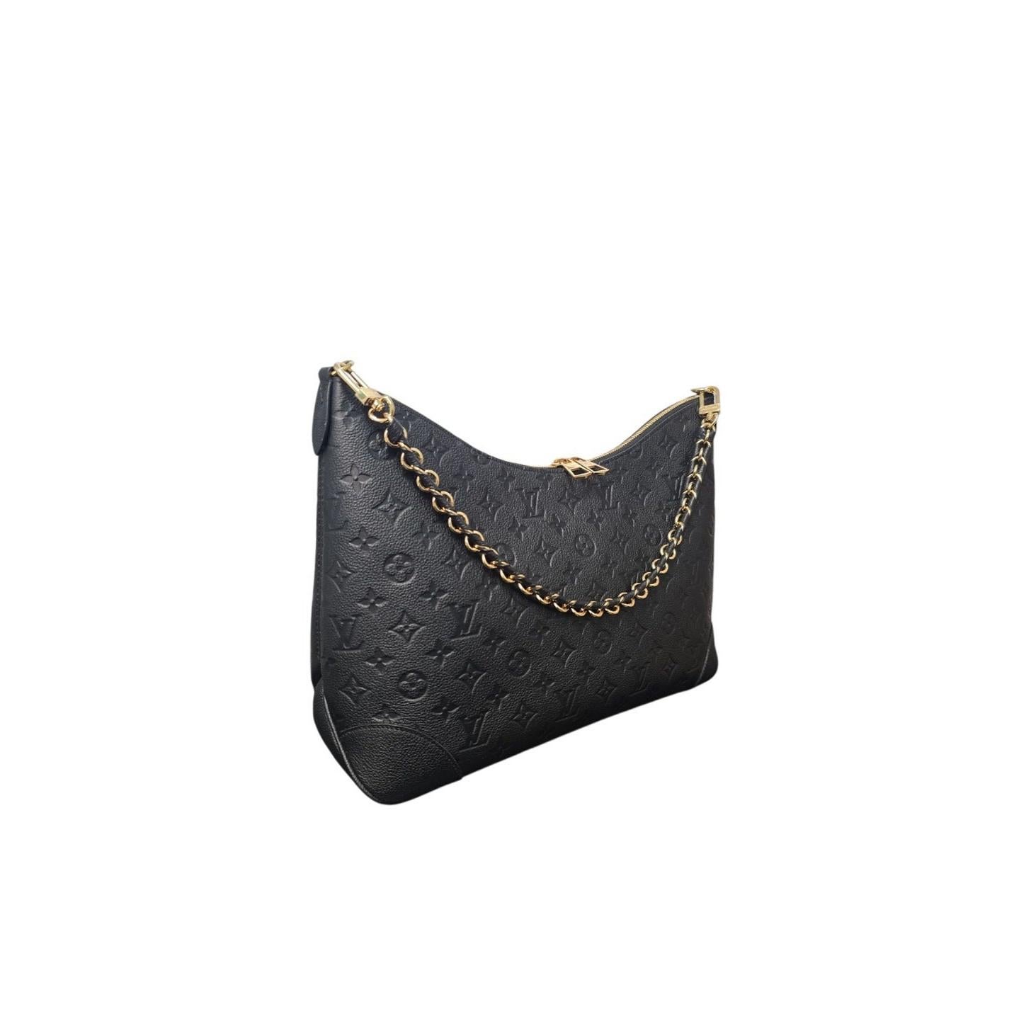 Eleganza con la borsa Monogram Empreinte Boulogne GM di Louis Vuitton, realizzata in morbida pelle Monogram goffrata per un'eleganza duratura. La versatile catena e le cinghie in pelle regolabili offrono un comfort personalizzabile, mentre la