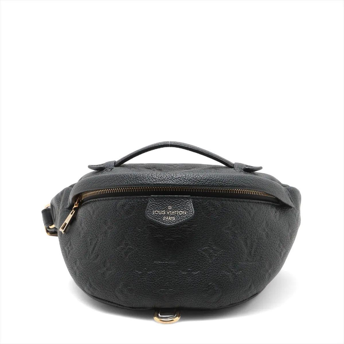 The Louis Vuitton Monogram Empreinte Bum Bag in Black is a chic and contemporary accessory that seamlessly blends luxury with versatility. Crafted from supple Monogram-embossed Empreinte leather, the sleek design features gold-tone hardware and an