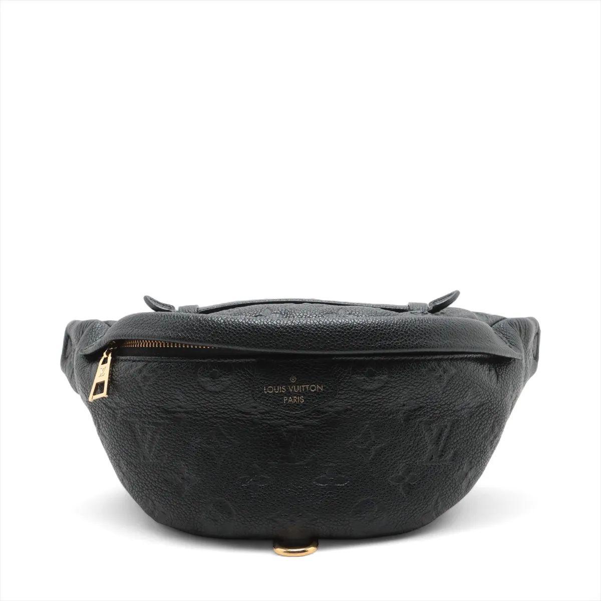 The Louis Vuitton Monogram Empreinte Bum Bag in Black is a chic and contemporary accessory that seamlessly blends luxury with versatility. Crafted from supple Monogram-embossed Empreinte leather, the sleek design features gold-tone hardware and an