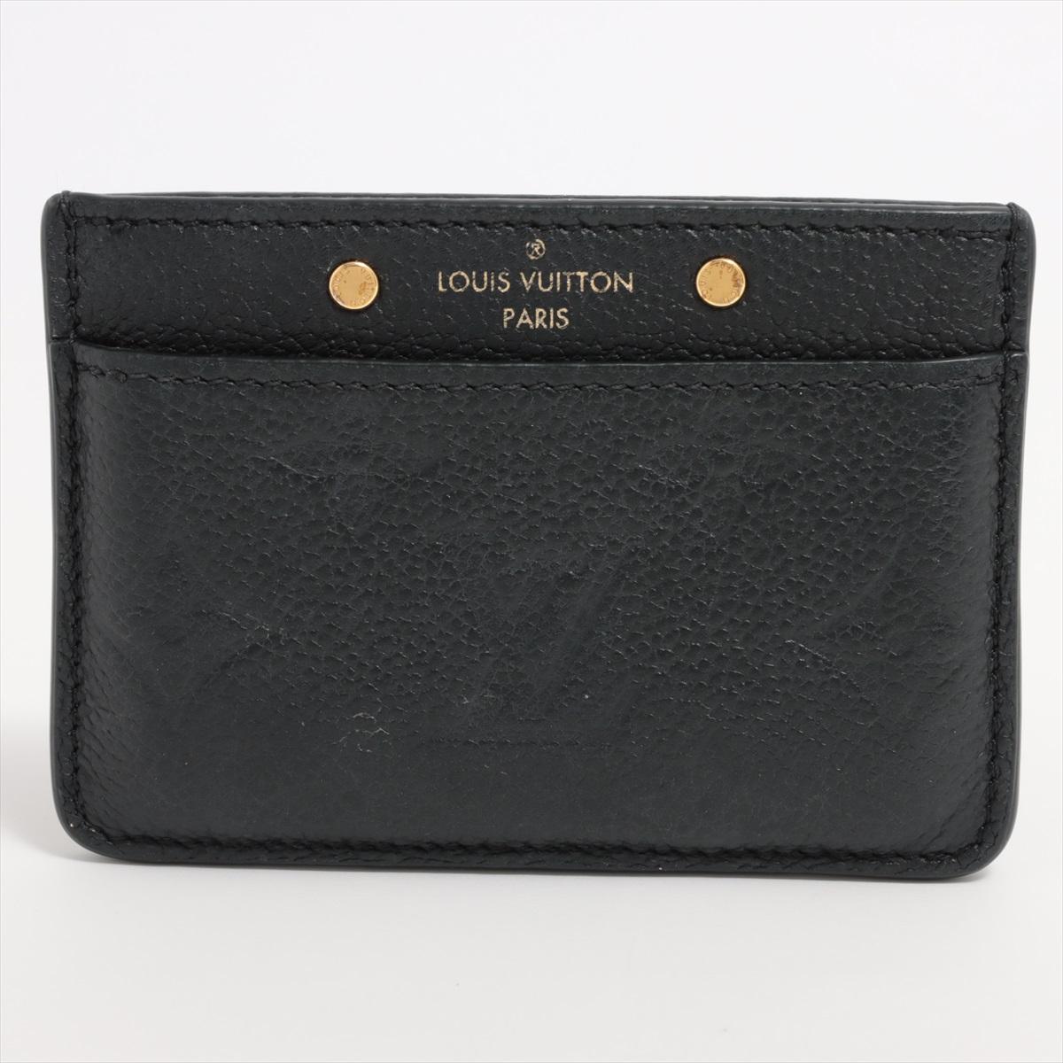 The Louis Vuitton Monogram Empreinte Card Case in Black a sleek and refined accessory that seamlessly blends sophistication with functionality. Crafted from Louis Vuitton's exquisite Empreinte leather, the card case features a luxuriously textured