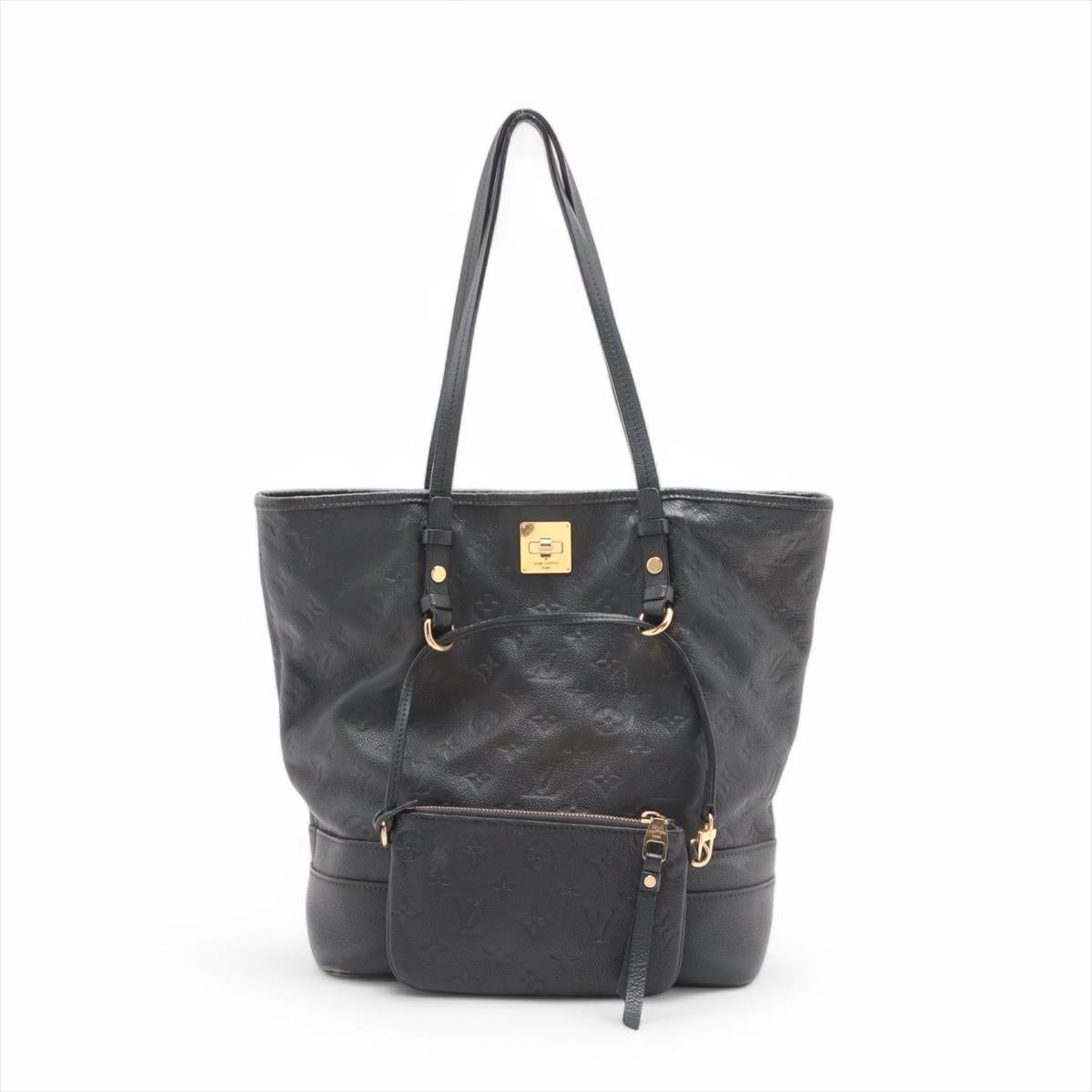 The Louis Vuitton Monogram Empreinte Citadine PM is a chic and practical tote bag crafted from the brand's iconic Monogram Empreinte leather, known for its embossed pattern and luxurious texture. The bag features a spacious interior with ample room