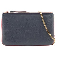 Louis Vuitton Monogramme Empreinte pochette à double fermeture éclair Marine Rouge
