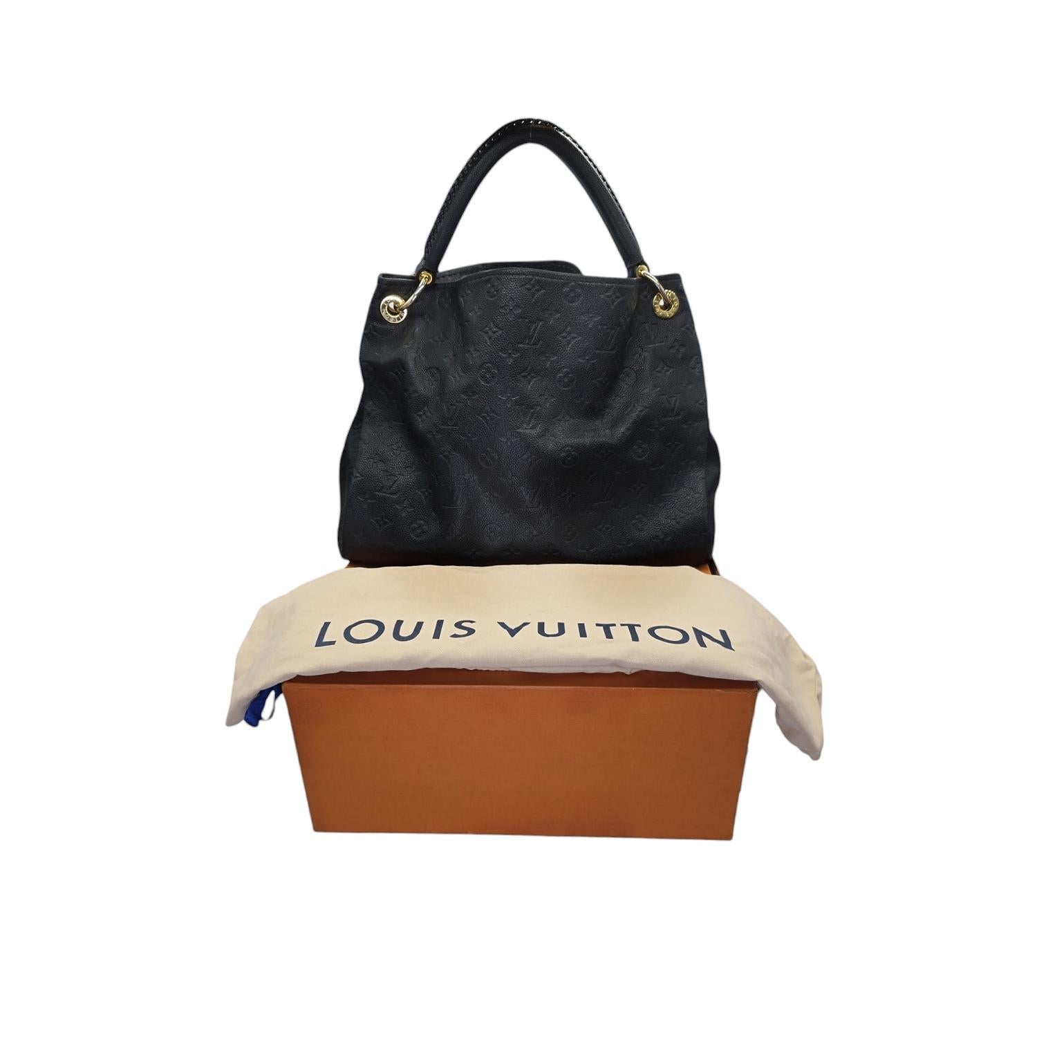 ndulge in understated luxury with the Louis Vuitton Monogram Empreinte Leather Artsy MM Hobo. Made from supple, embossed cowhide leather, this exquisite handbag boasts a handcrafted handle and gleaming golden hardware. Spacious and organized, it
