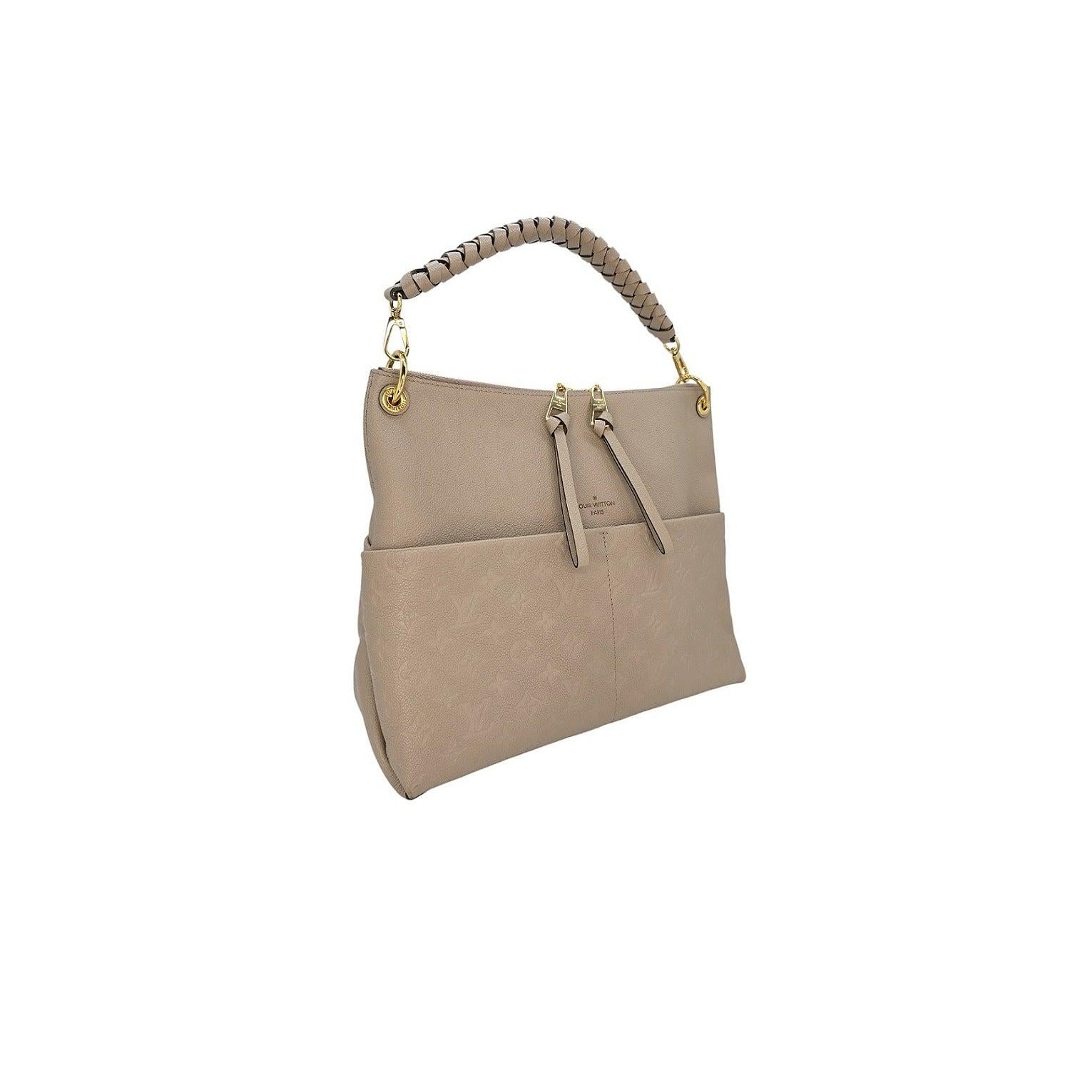 Expertly crafted by Louis Vuitton, the Monogram Empreinte Maida Hobo is a luxurious blend of grained leather and embossed cowhide. With a removable top handle and two large front pockets, this bag offers both style and convenience, while the