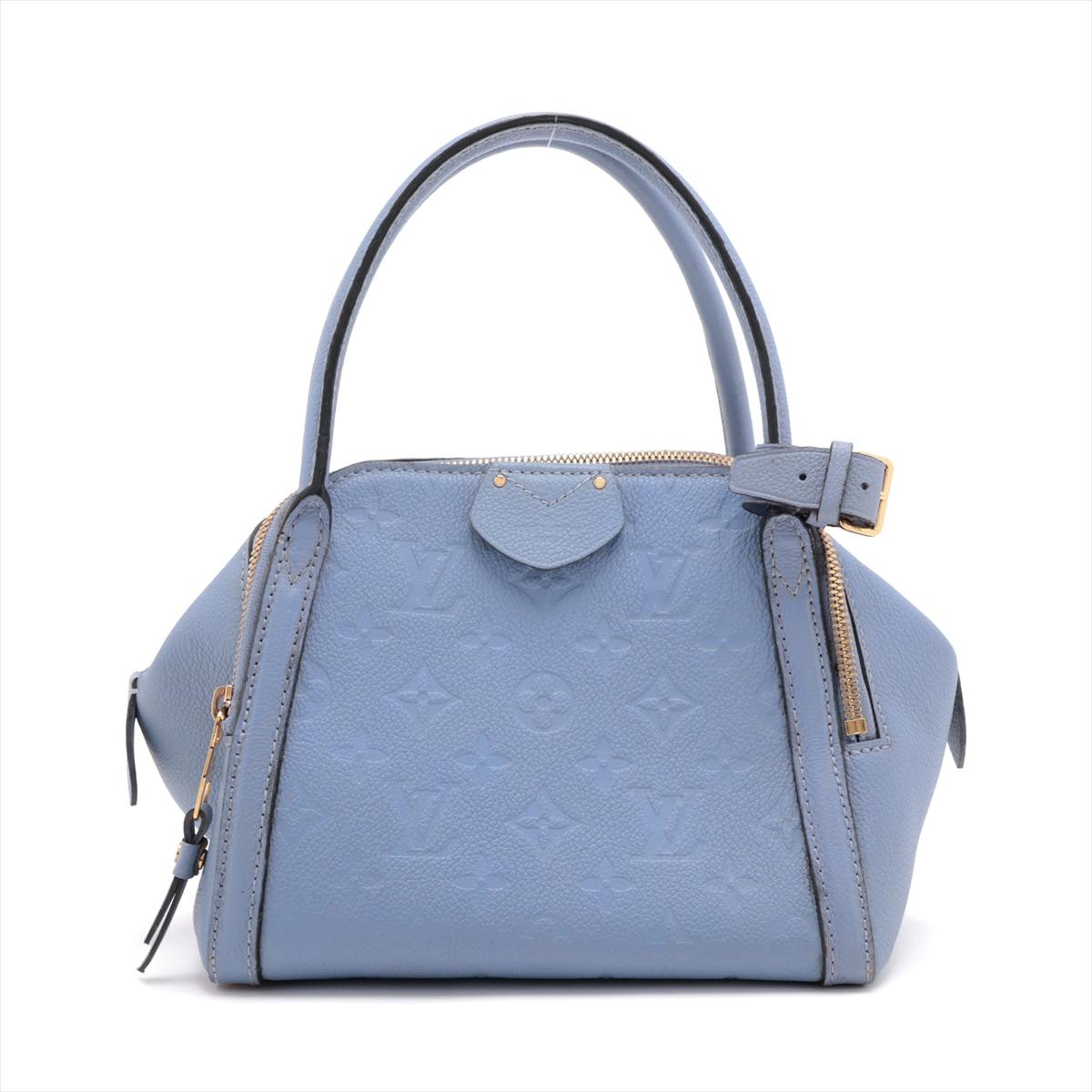 The Louis Vuitton Monogram Empreinte Marais BB in Lilac is a stunning and sophisticated handbag that effortlessly combines timeless elegance with modern style. Crafted from luxurious Monogram Empreinte leather, the bag showcases the iconic LV