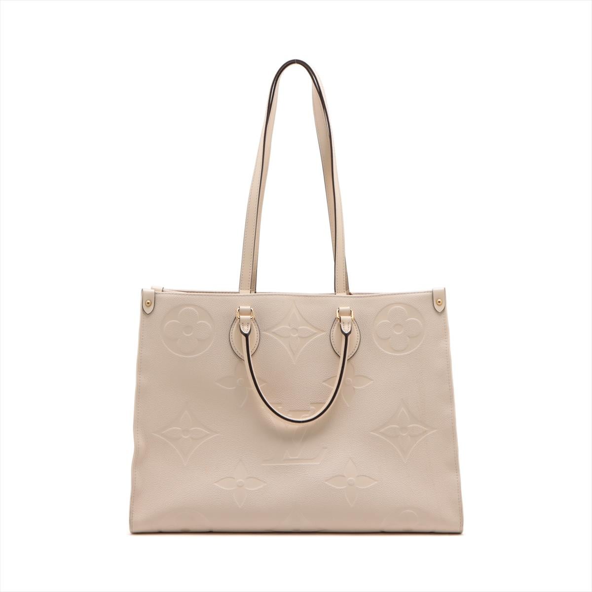 The Louis Vuitton Monogram Empreinte On the Go GM in Crème is a luxurious and sophisticated tote that seamlessly merges style with practicality. Crafted from the iconic Monogram Empreinte leather, the bag features an embossed monogram pattern,