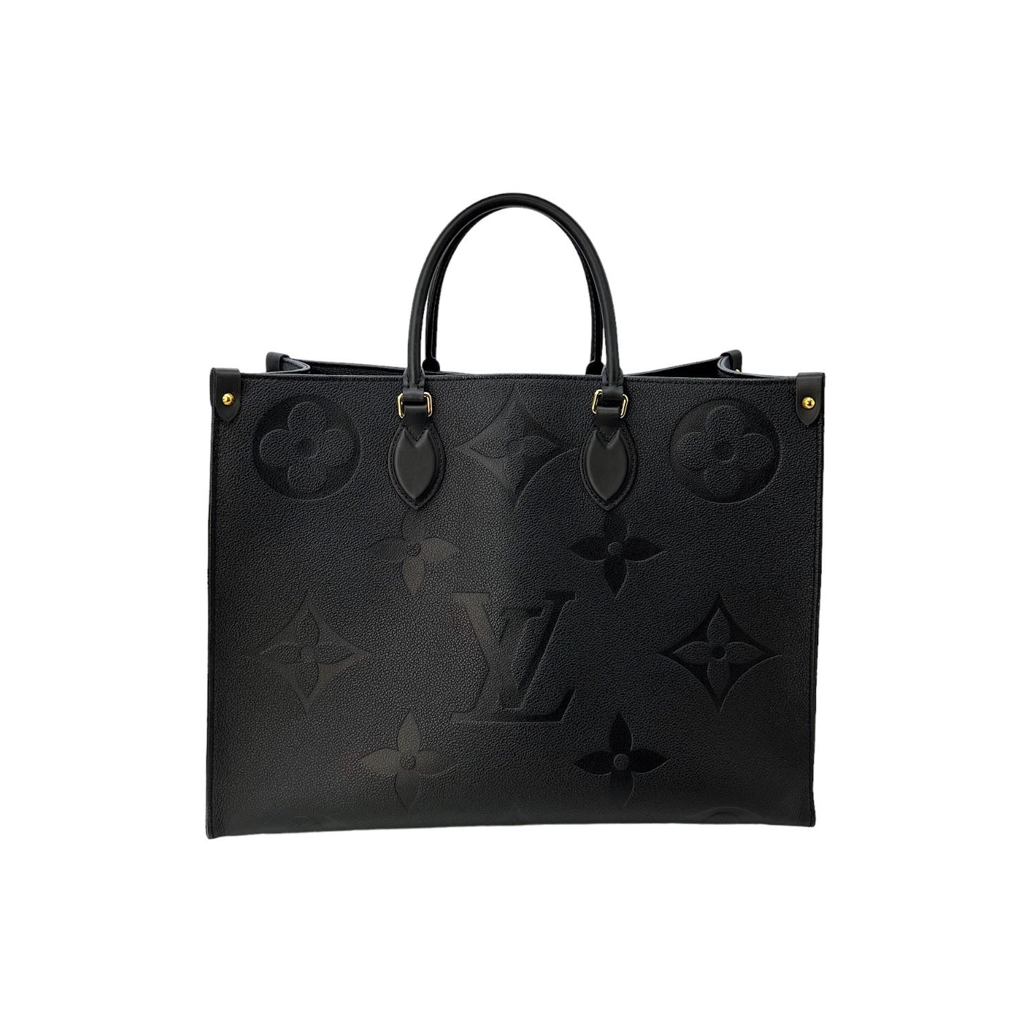 This Louis Vuitton Onthego GM is finely crafted of a black Louis Vuitton Monogram Empreinte grained leather exterior with leather trimmings and gold-tone hardware features. It has dual rolled leather handles and it also has dual flat shoulder straps
