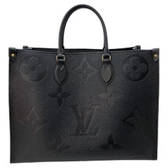 Louis Vuitton Tourterelle Monogram Empreinte Giant Neverfull MM For Sale at  1stDibs
