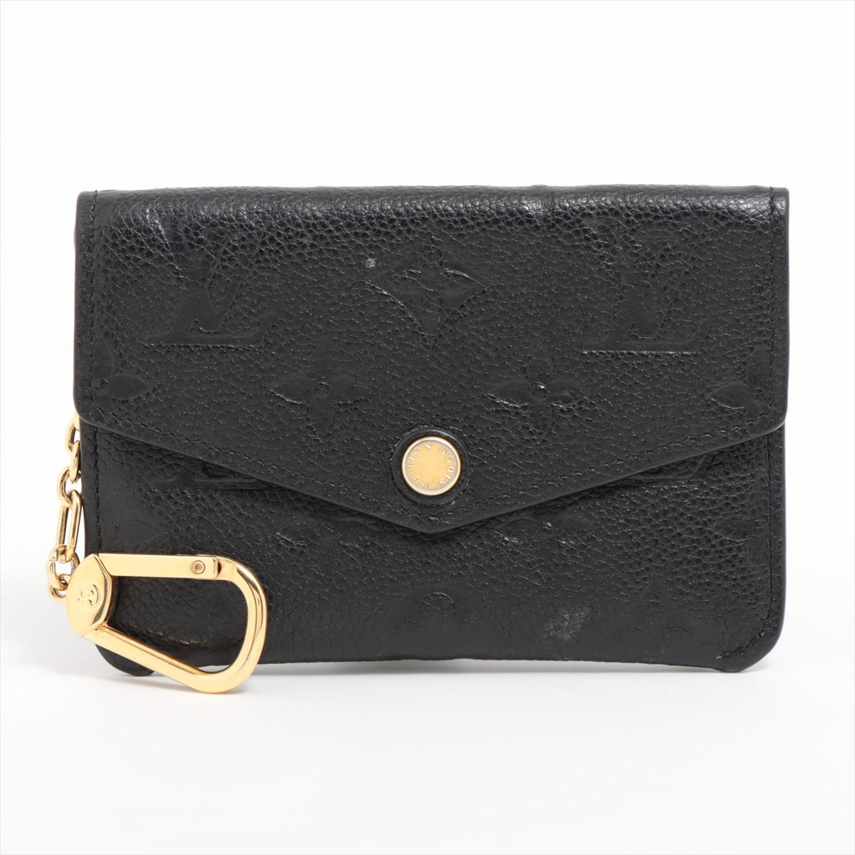 The Louis Vuitton Monogram Empreinte Pochette Cles Coin Case is a sleek and elegant accessory that combines style with practicality. The coin case features a compact and slim design, making it perfect for storing your coins, keys, or other small