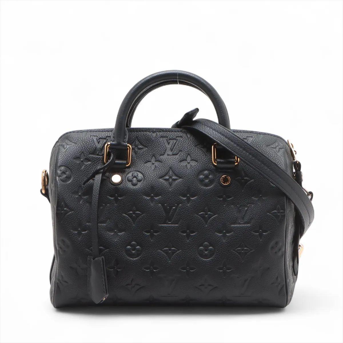 The Louis Vuitton Monogram Empreinte Speedy 25 in black is a sophisticated take on one of the maison’s most iconic bags. Crafted from supple Monogram Empreinte leather embossed with the signature LV pattern, it showcases a structured yet elegant