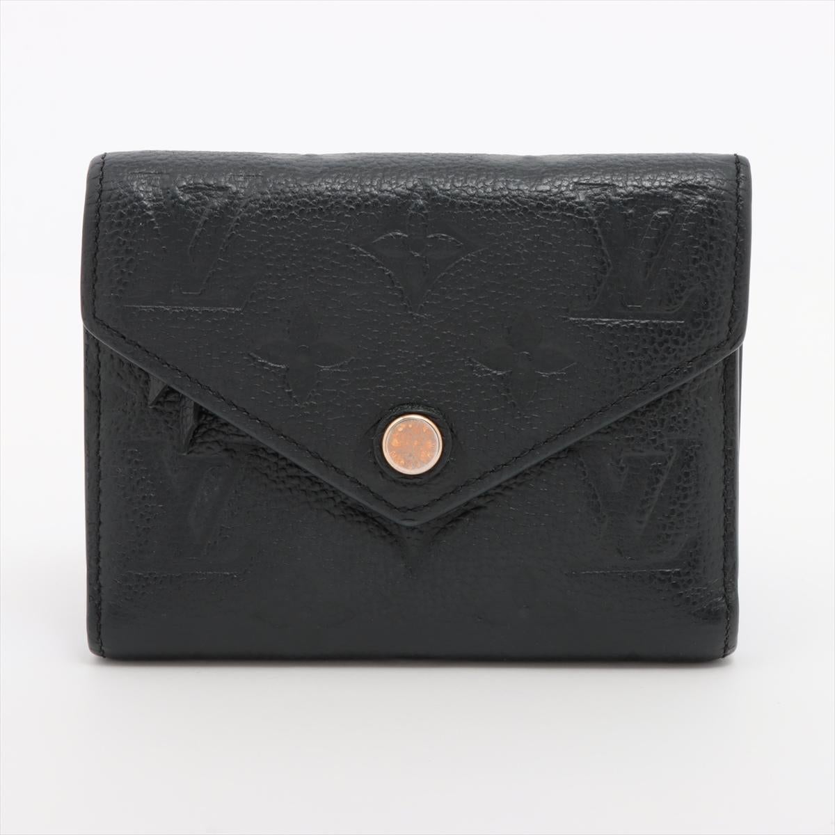 The Louis Vuitton Monogram Empreinte Victorine Wallet in Black is a compact yet elegant accessory that perfectly balances luxury and functionality. Crafted from soft Monogram Empreinte leather, the wallet features embossed LV Monogram pattern,