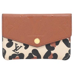 Louis Vuitton Monogram Empreinte Wild at Heart Pochette Portamonete