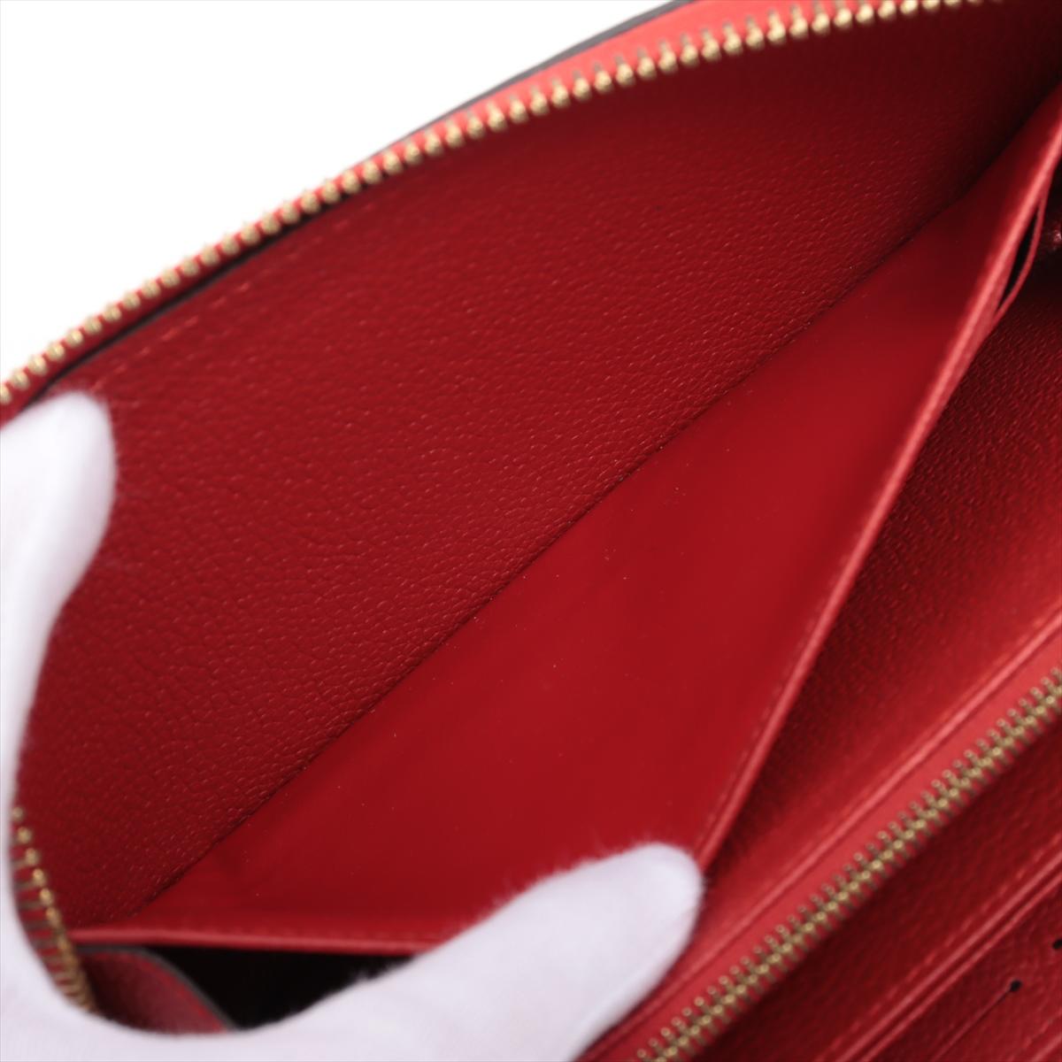 Louis Vuitton Portefeuille rouge Empreinte à fermeture Éclair Monogramme en vente 1