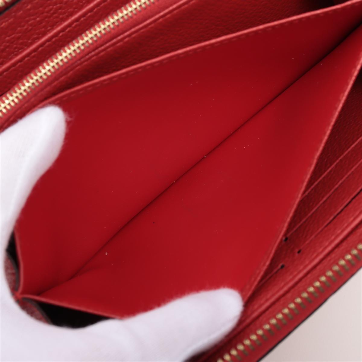 Louis Vuitton Portefeuille rouge Empreinte à fermeture Éclair Monogramme en vente 2