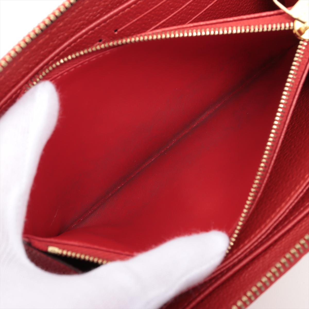 Louis Vuitton Portefeuille rouge Empreinte à fermeture Éclair Monogramme en vente 4
