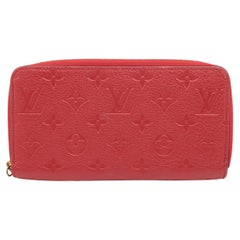 Louis Vuitton Portefeuille rouge Empreinte à fermeture Éclair Monogramme