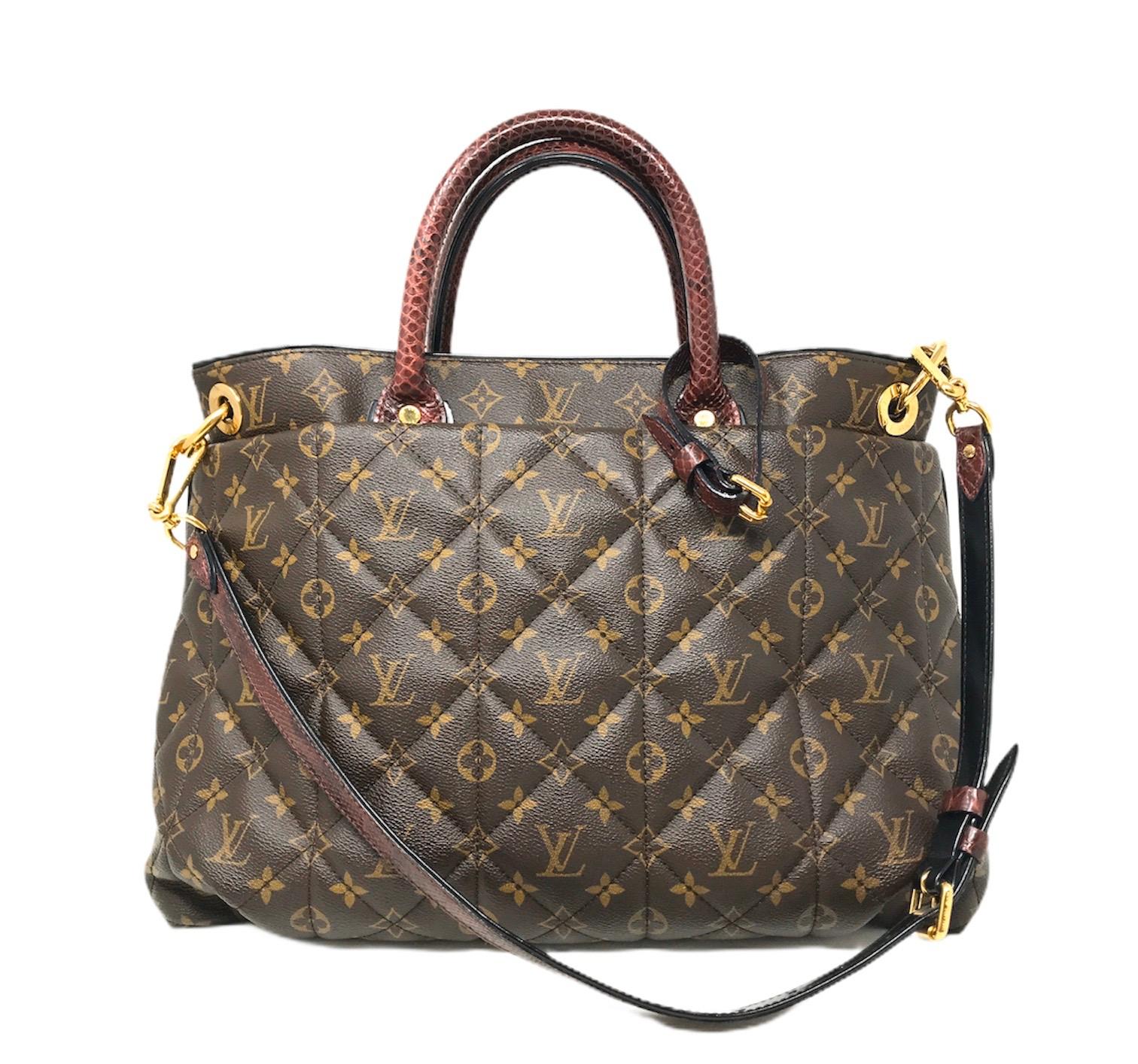 This is a fabulous, one of a kind large tote that is beautifully crafted of soft Louis Vuitton monogram diamond quilted canvas. The bag features python top handles, a python shoulder strap, ostrich leather lining, polished brass hardware as well as