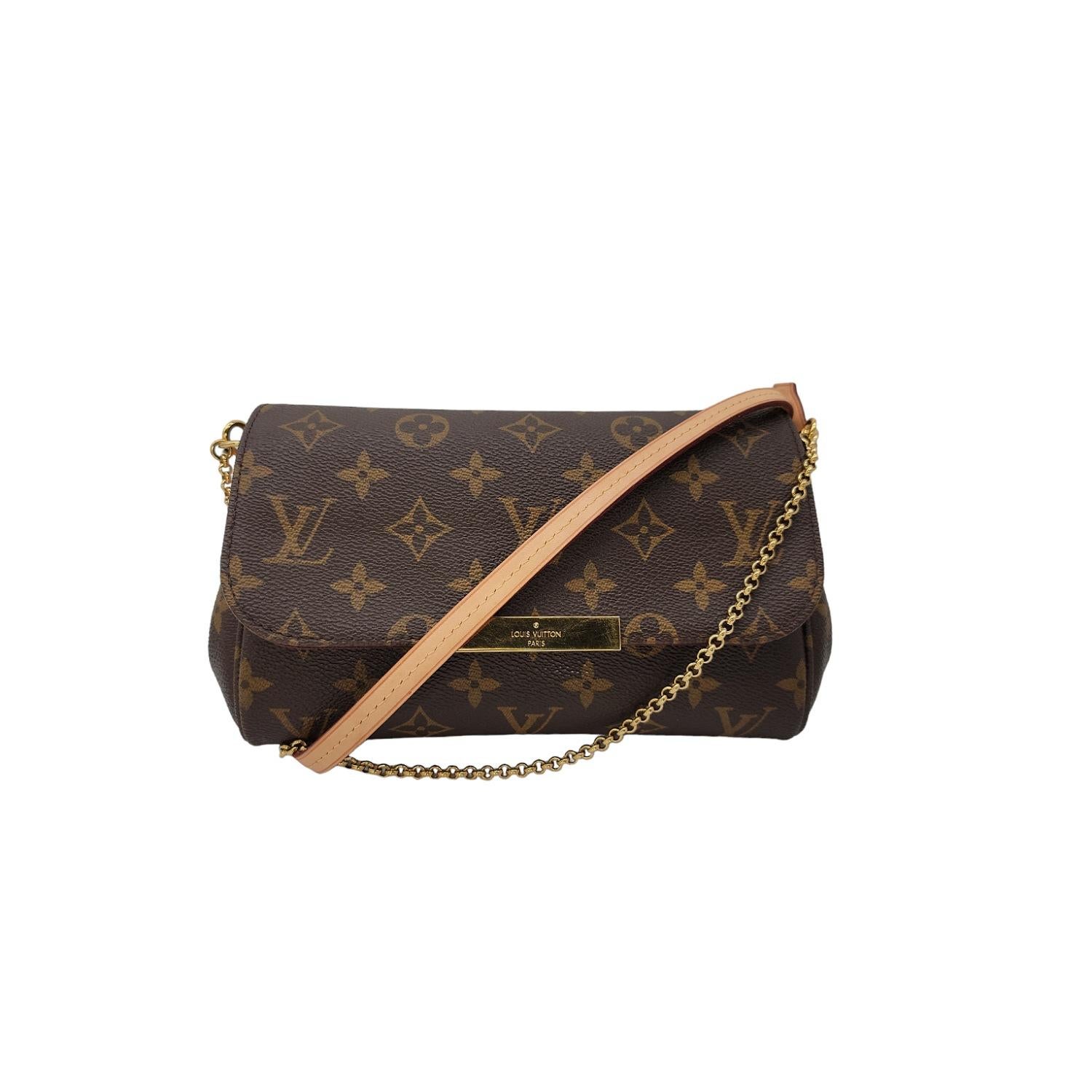 This stylish bag is crafted of a long and thin pouch of durable Monogrammed Louis Vuitton coated canvas with natural vachetta cowhide leather piping at the sides and trimmed with a frontal Louis Vuitton signature name plate in brass. This versatile