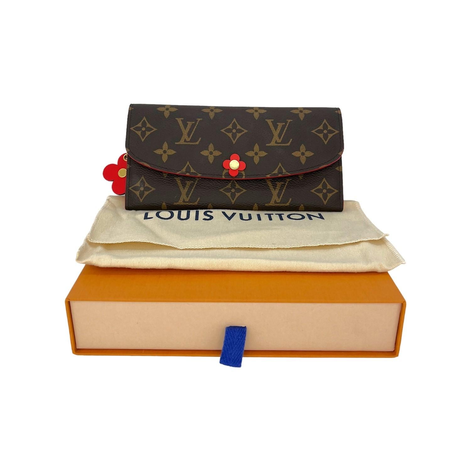 This Louis Vuitton Flower Emilie Wallet was made in France and it is finely crafted of the iconic Louis Vuitton Monogram coated canvas exterior with leather trimming and gold-tone hardware features. It has a very beautiful flower design. It has a