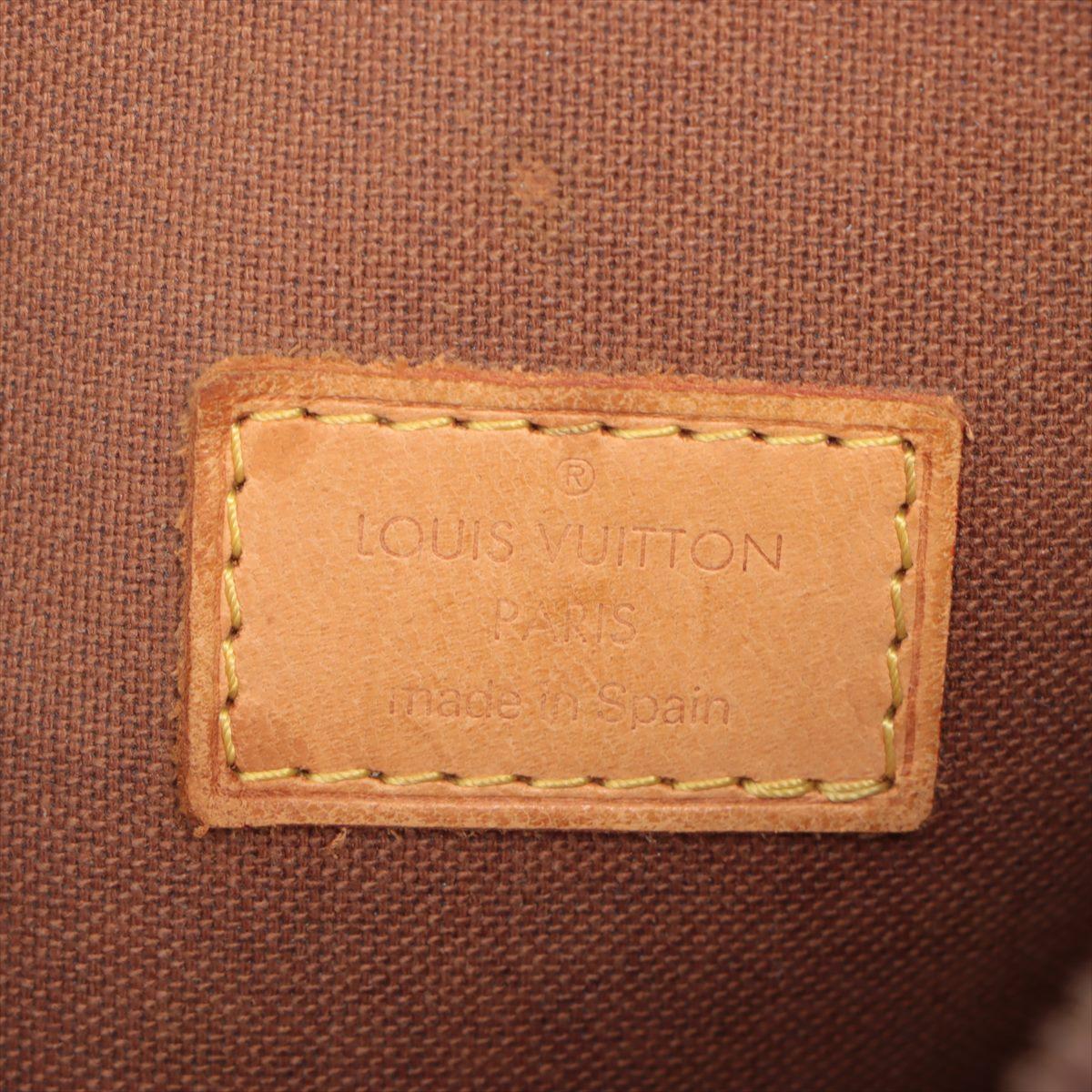 Louis Vuitton brown Monogram Pochette Gange waist bag with gold-tone hardware, tan Vachetta leather trim, exterior slip pocket, adjustable fabric strap, and zipper closure. 

 

55395MSC