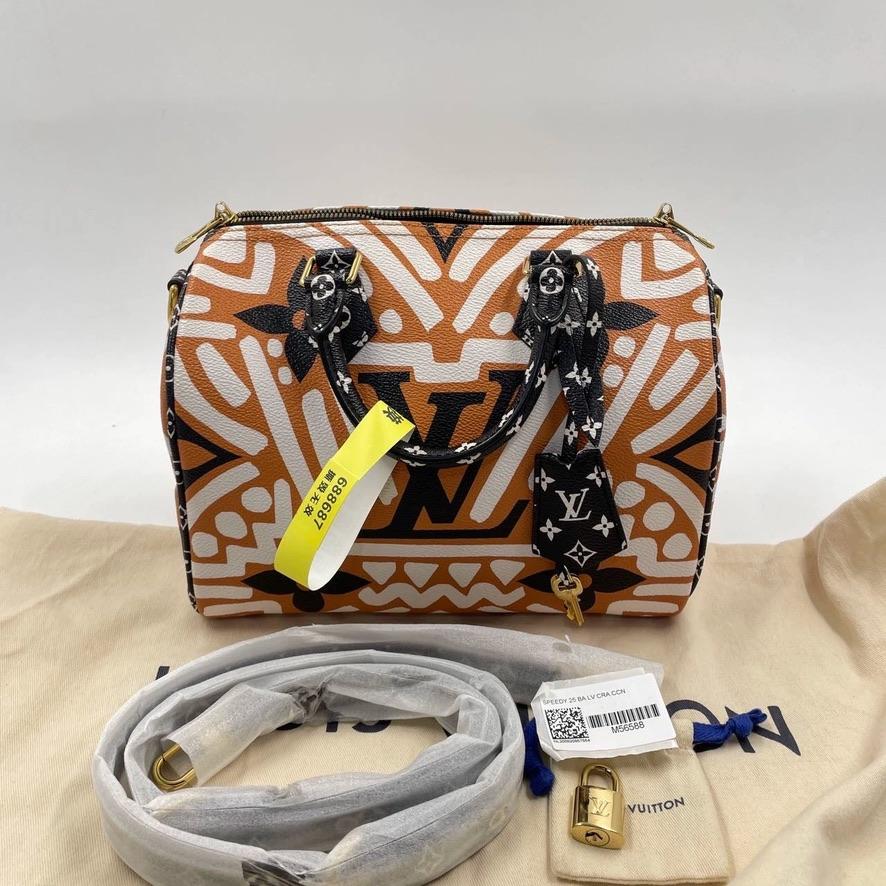 

Louis Vuitton Caramel, Black, and White Giant Monogram Crafty Coated Canvas Speedy Bandoulière 25 Gold Hardware, 2020

    The interior is lined in caramel monogram textile material
    The Crafty collection was inspired by two artistic movements