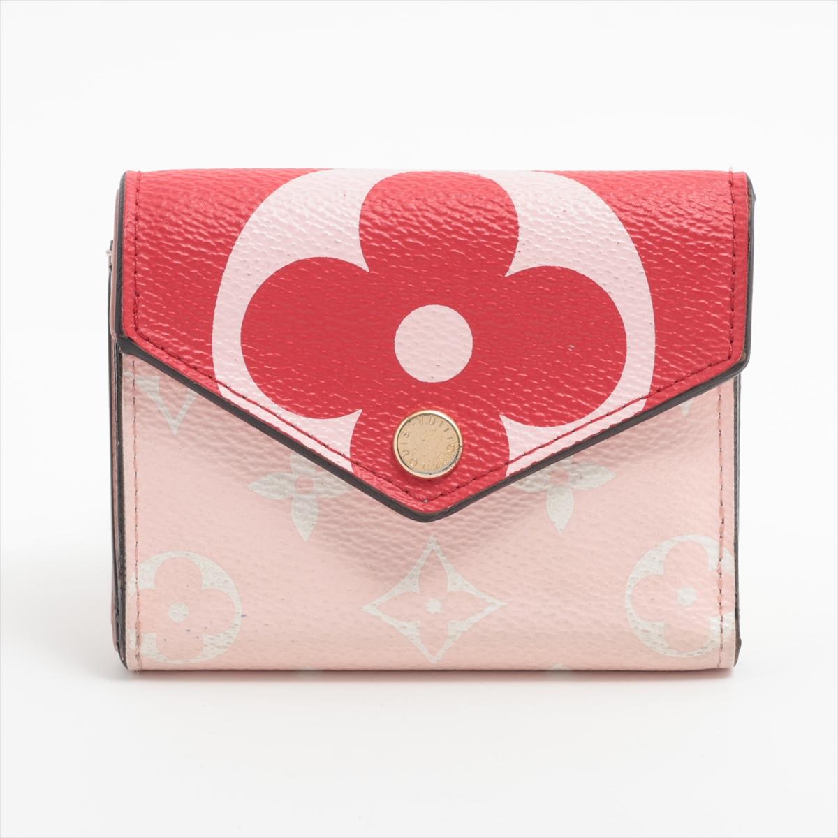 The Louis Vuitton Monogram Giant Portefeuille Zoé in Red and Pink is a vibrant and chic accessory that adds a pop of color to any ensemble. Crafted from the iconic giant Monogram canvas, the wallet showcases Louis Vuitton's timeless design with a