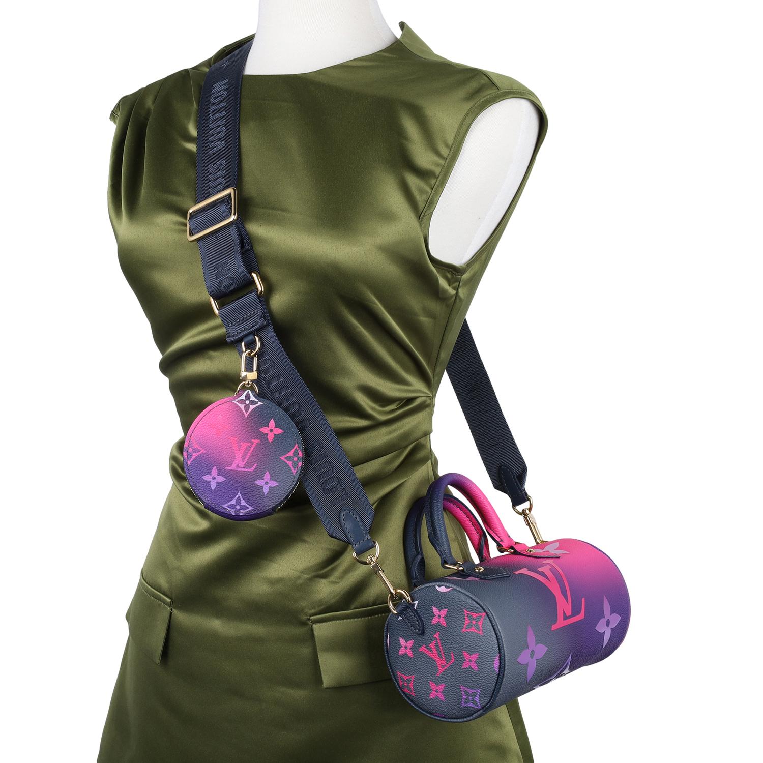 Authentic Like New Louis Vuitton Monogram Giant Spring In The City Papillon BB in Midnight Fuchsia. Features a new gradient colorway of monogram canvas, a graphic oversize motif, and a round coin purse snaps onto the wide jacquard strap, adding a