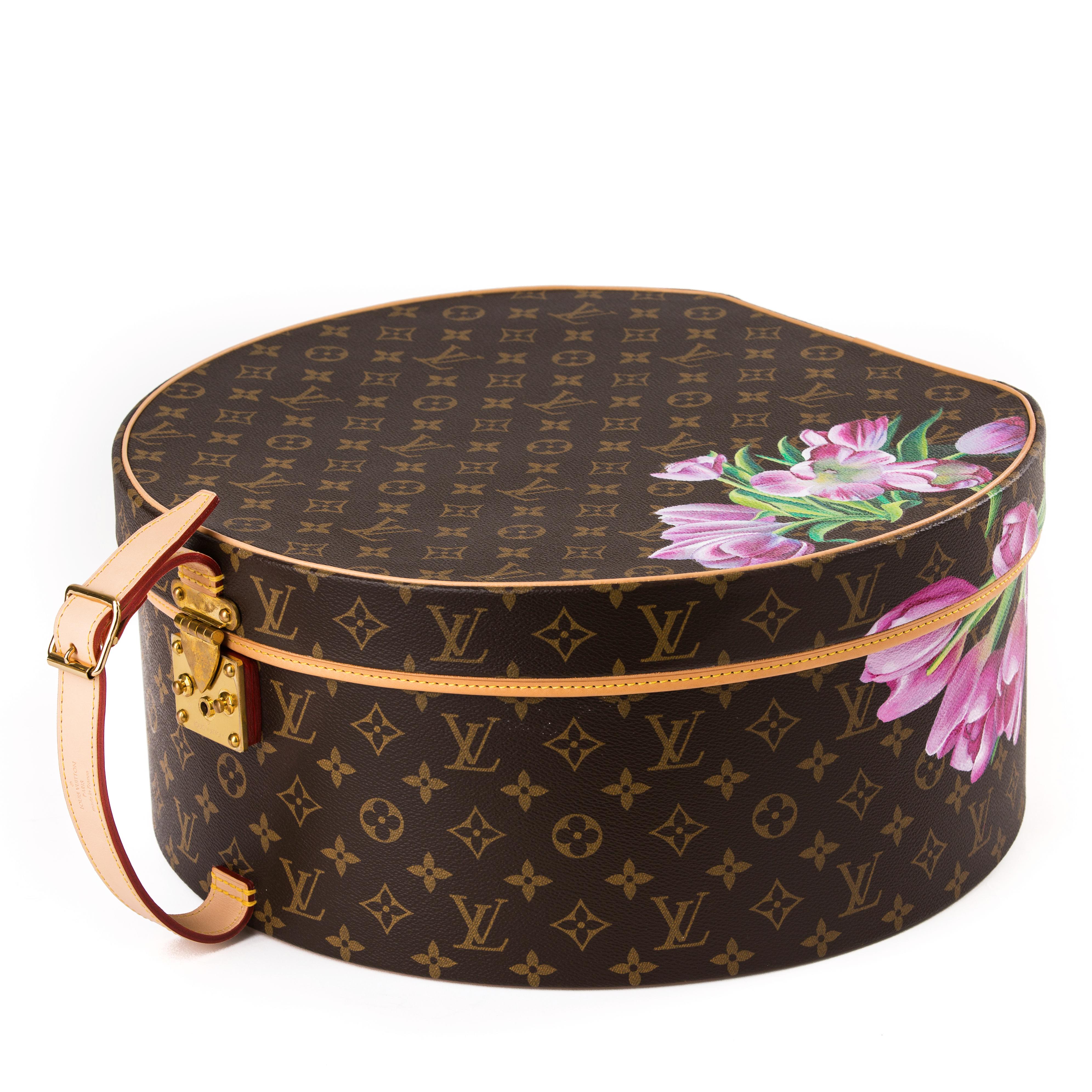 Louis Vuitton monogram hat box with floral design.
Hand painted in Beverley Hills exclusively for Palmer & Penn.
This beautiful item is a unique one off piece.