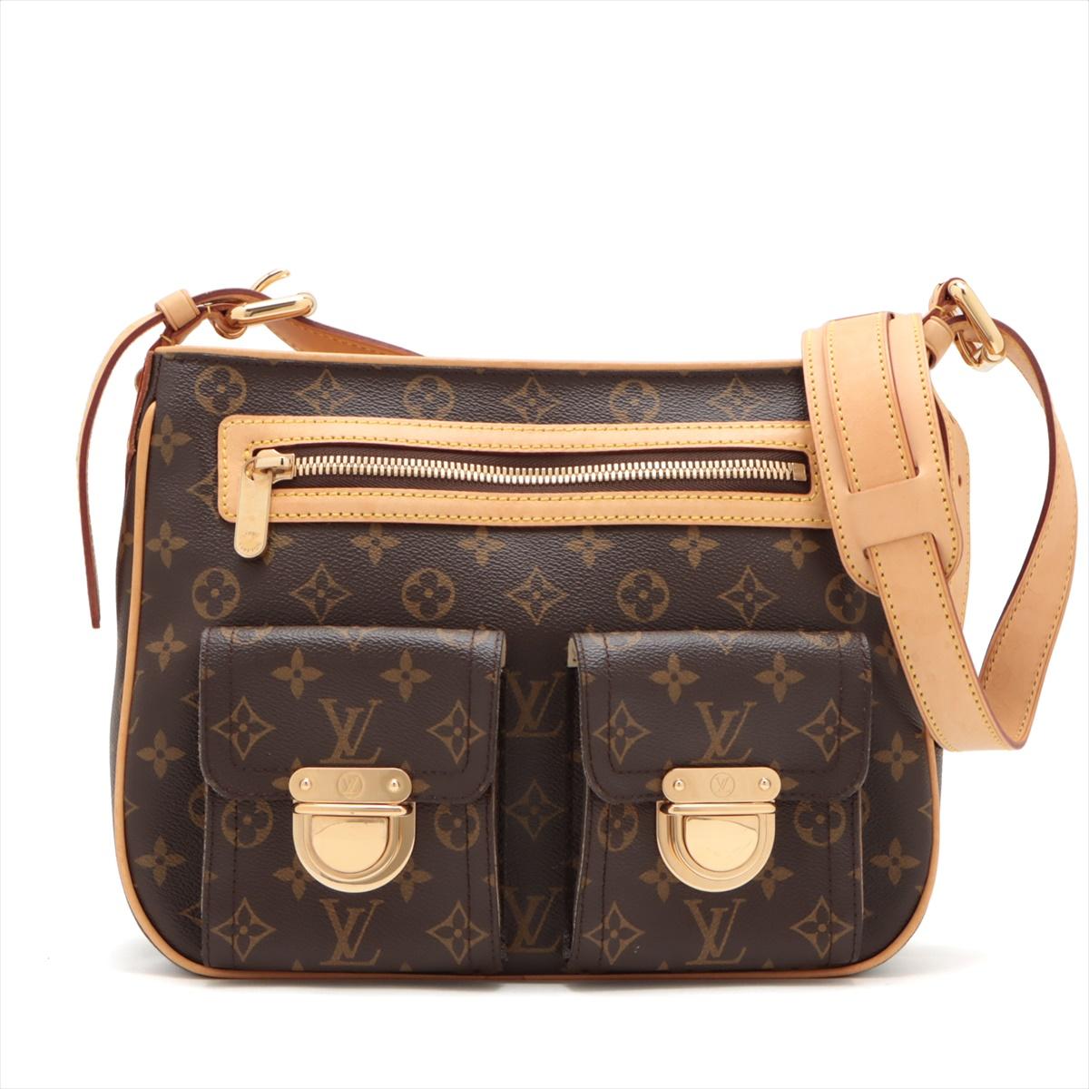 The Louis Vuitton Monogram Hudson GM Shoulder Bag is a striking and versatile accessory that seamlessly combines the iconic Monogram canvas with a functional and contemporary design. The Monogram canvas, featuring the renowned LV pattern, forms the