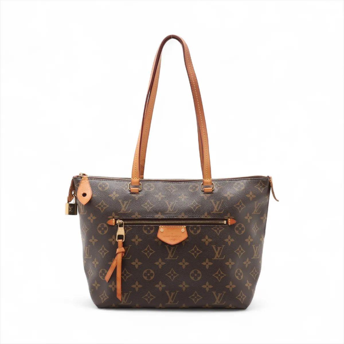 The Louis Vuitton Monogram Iéna PM is a stylish and practical tote crafted from the house’s iconic Monogram canvas. Designed with a lightweight and structured silhouette, it features natural cowhide leather trim and gold-tone hardware for a refined