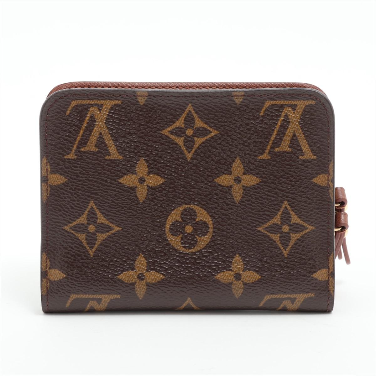 The Louis Vuitton Monogram Insolite Bifold Short Wallet is a stylish and practical accessory designed for everyday use. Made from the iconic Monogram canvas, the wallet showcases Louis Vuitton's timeless design. Its compact bifold silhouette opens