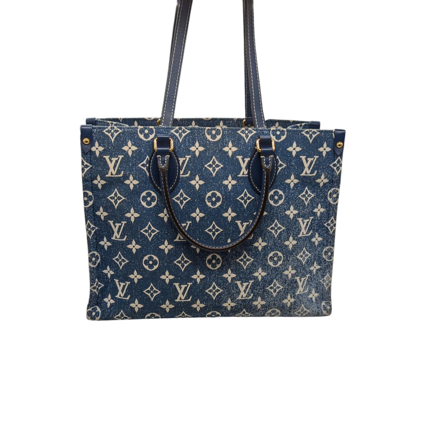 This Limited Edition tote from Louis Vuitton features a fresh and fashionable stonewashed denim with the classic Monogram jacquard motif. The bag has matching leather handles. The interior is perfect for toting your everyday items and is a great