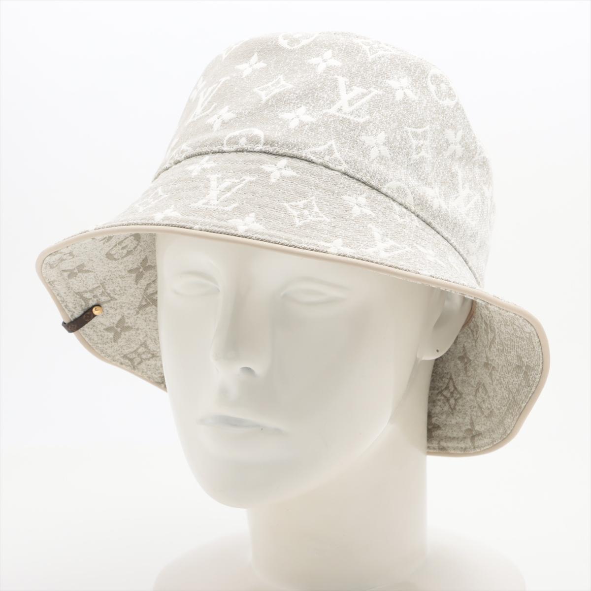 The Louis Vuitton Monogram Jacquard Denim Bucket Hat in Greige is a stylish and versatile accessory that merges luxury with casual flair. Crafted from premium denim jacquard fabric adorned with the iconic LV monogram pattern, the hat exudes