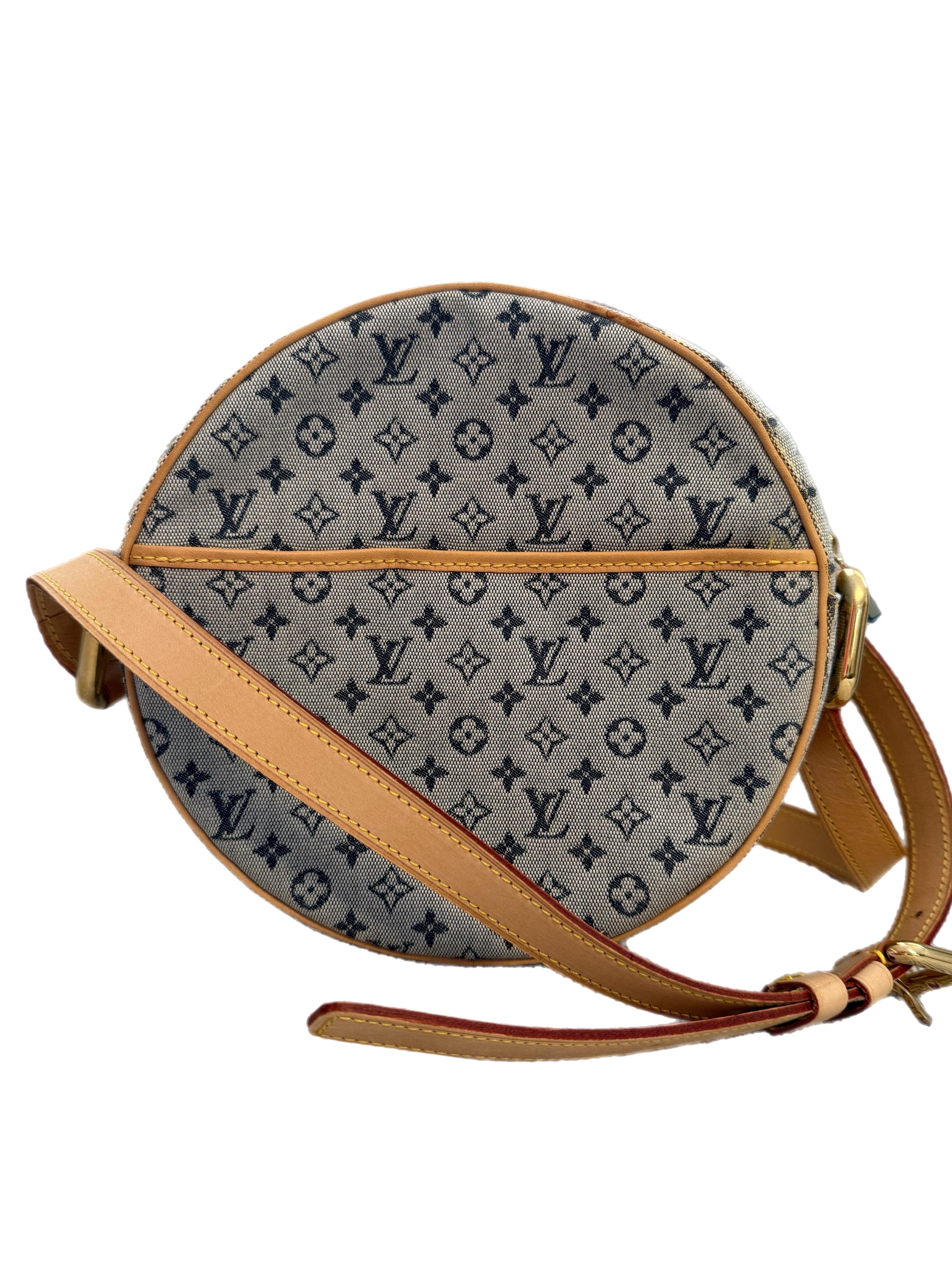 The Louis Vuitton Monogram Jeanne Round Shoulder Bag in Blue is a chic and modern take on a classic silhouette. Crafted from iconic Monogram canvas, the bag features a unique circular shape that adds a contemporary touch to its timeless design. The