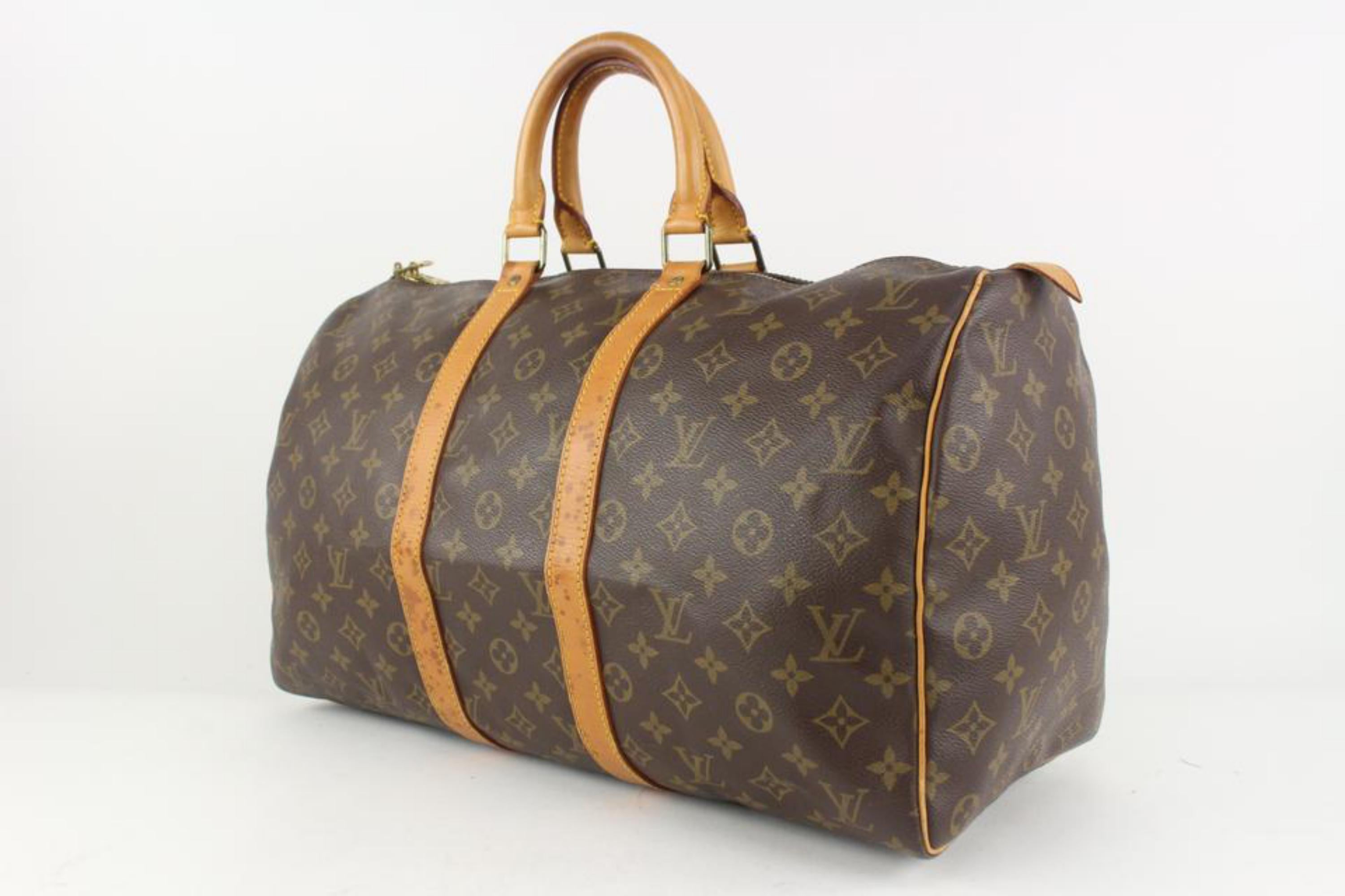 Louis Vuitton Monogram Keepall 45 Boston Duffle Bag 1119lv48
Date Code/Serial Number: VI8909
Made In: France
Measurements: Length:  18